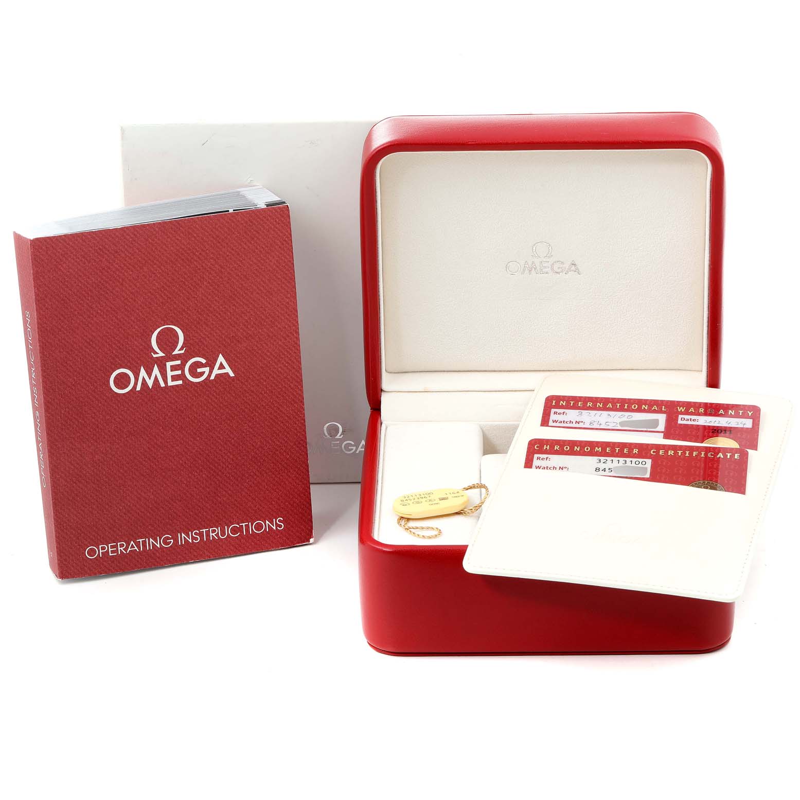 The image shows the packaging, operating instructions, international warranty card, and chronometer certificate for an Omega Speedmaster 3211.31.00 Men
s Stainless Steel Silver Dial 3211.31.00 Men
s Stainless Steel Silver Dial watch.