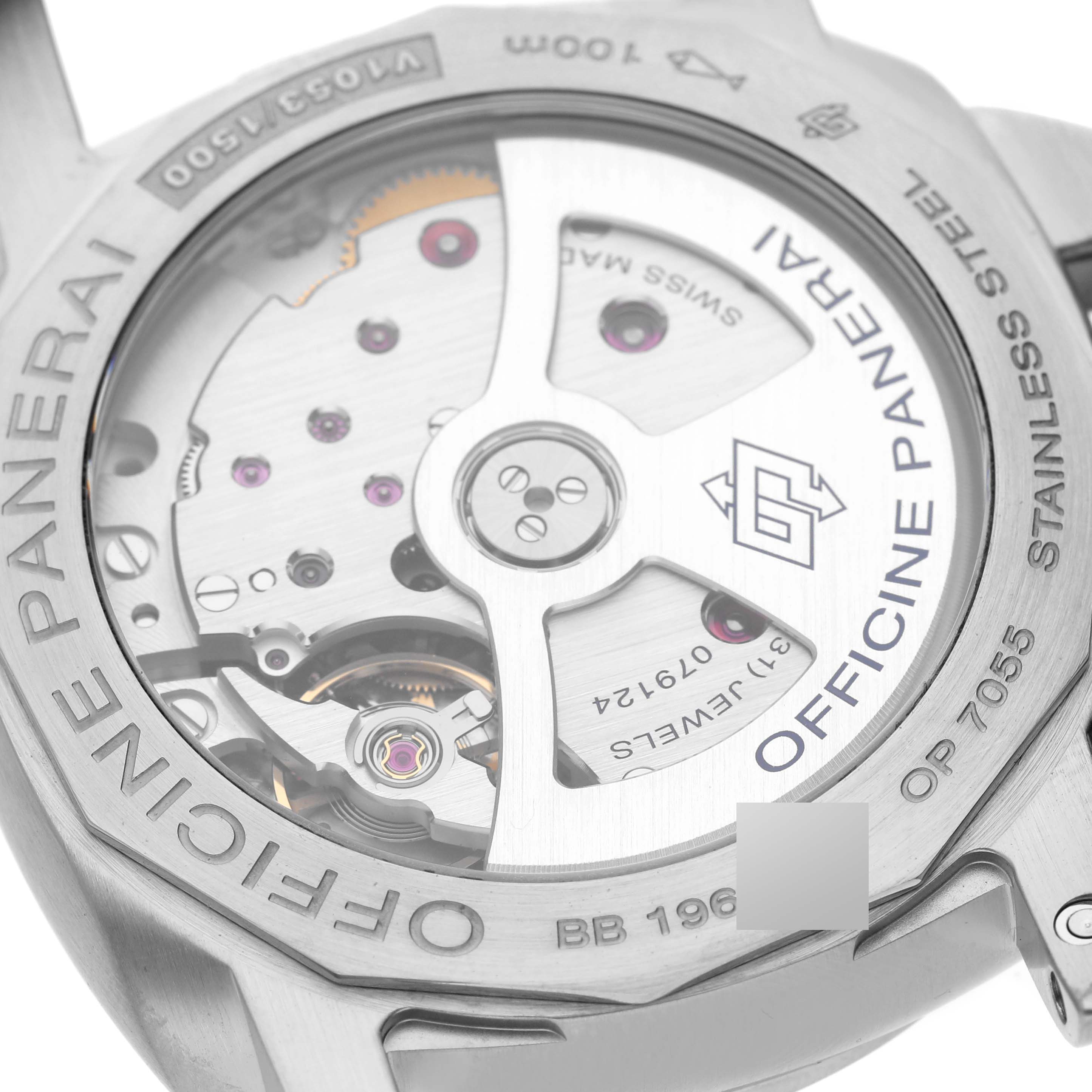 The image shows the back case of a Panerai Luminor PAM01392 Men
s Stainless Steel Black Dial PAM01392 Men
s Stainless Steel Black Dial watch, highlighting its visible mechanical movement.