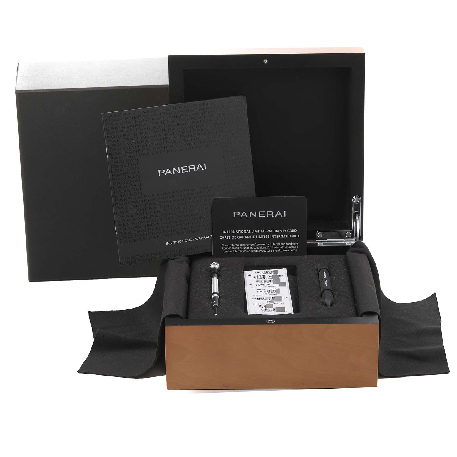 The image shows a Panerai Luminor PAM01392 Men
s Stainless Steel Black Dial PAM01392 Men
s Stainless Steel Black Dial watch package with manuals, warranty card, and watch tools at a front angle.