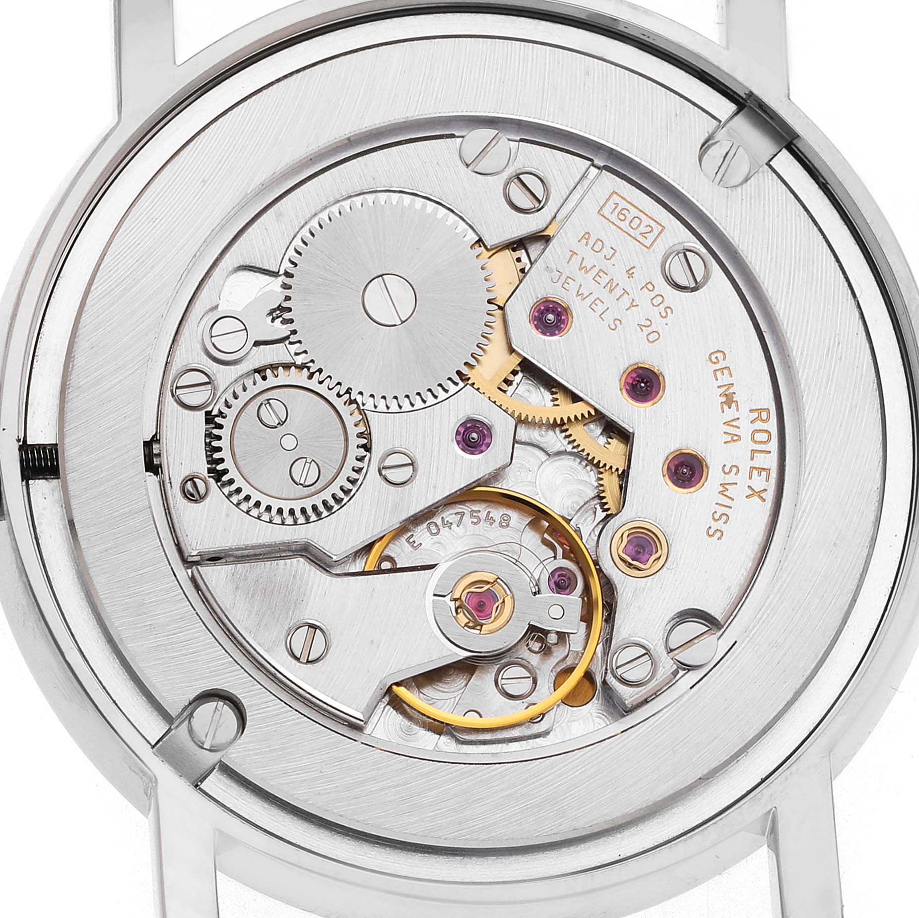 The image shows the movement of a Rolex Cellini 5115 Men's White Gold Mother of Pearl Dial watch viewed from the back, highlighting its intricate gears and components.