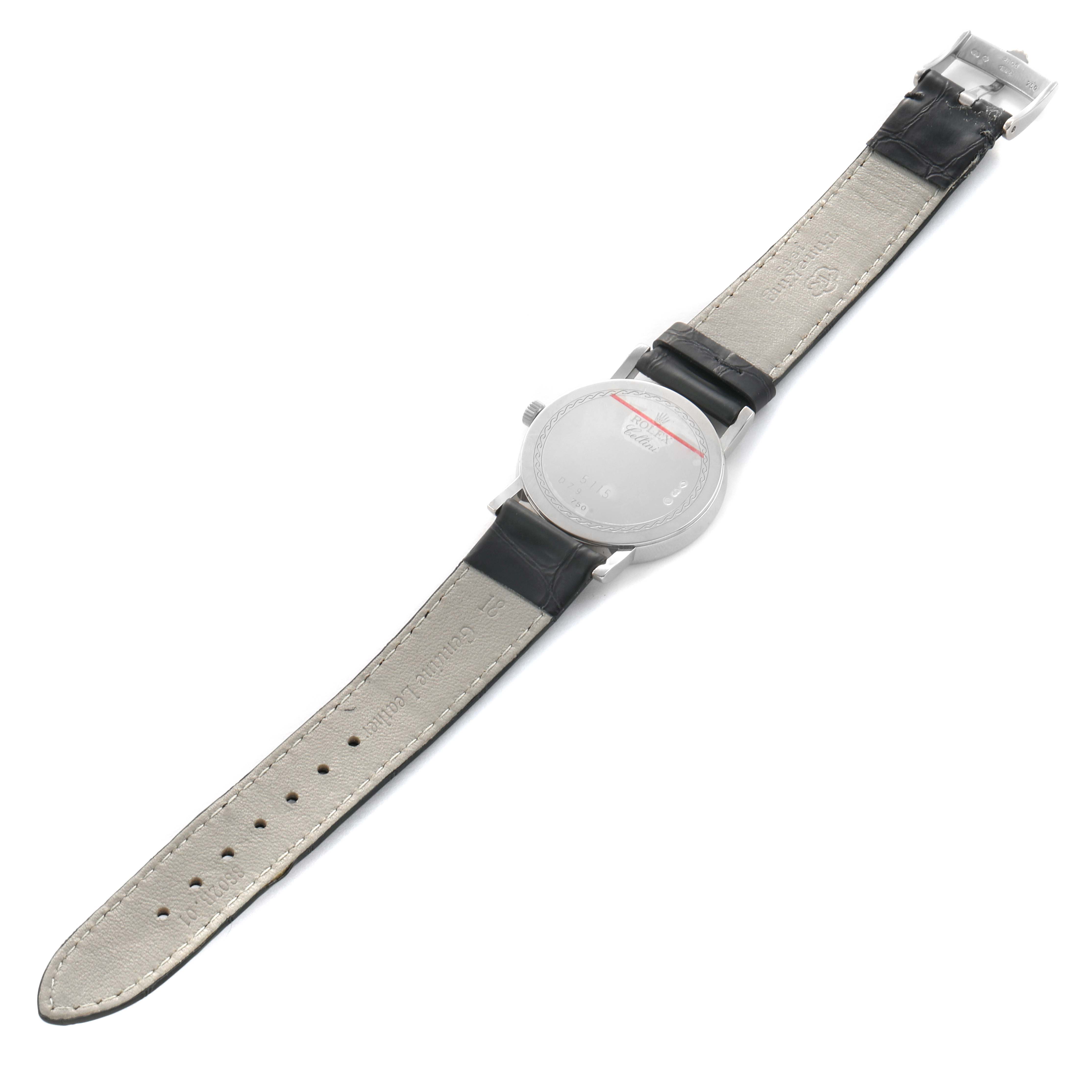 The image shows a Rolex Cellini 5115 Men's White Gold Mother of Pearl Dial watch from the back, displaying the case, leather strap, and buckle.