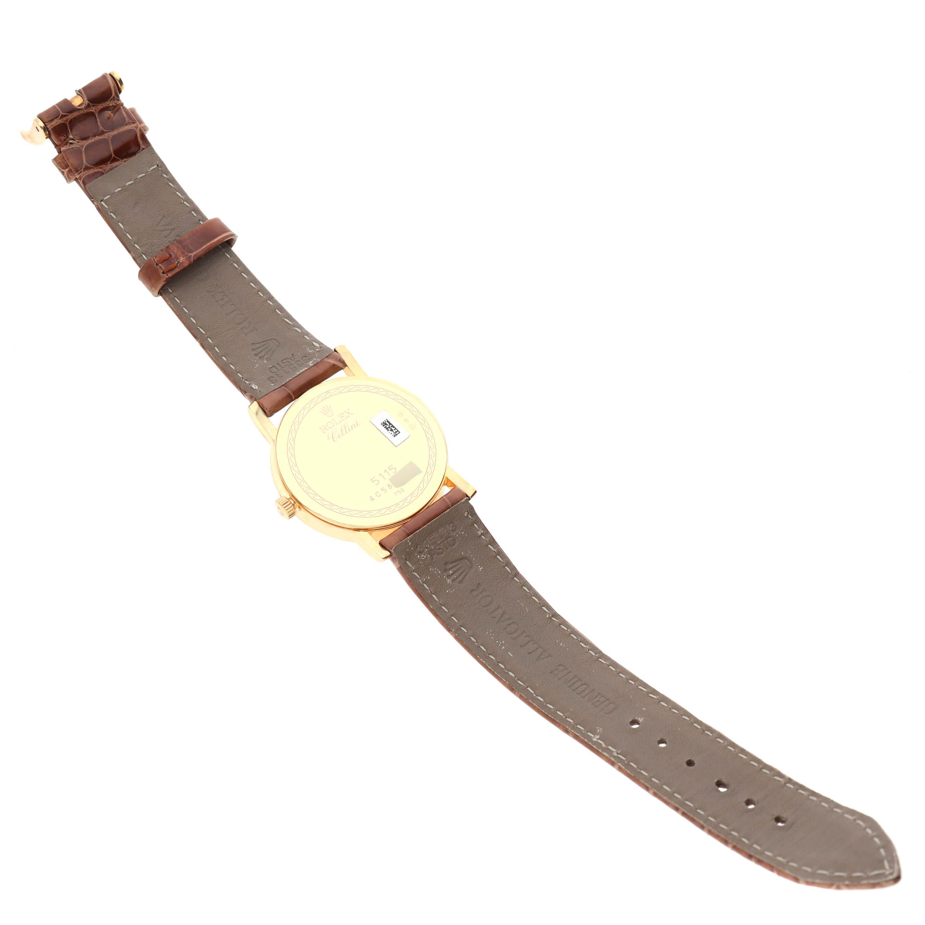 The image shows the back view of a Rolex Cellini 5115/8 Men's Yellow Gold Mother of Pearl Dial 5115/8 Men's Yellow Gold Mother of Pearl Dial watch, highlighting its case back and leather strap.