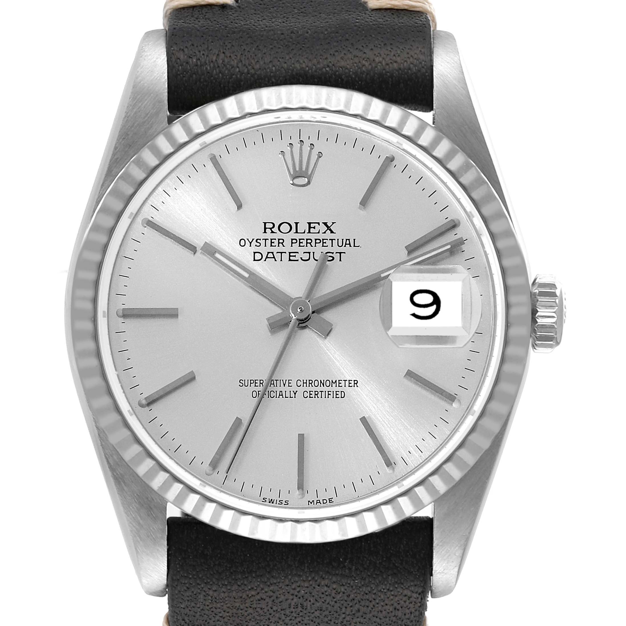 The Rolex Datejust 16234 Men's Stainless Steel Silver Dial 16234 Men's Stainless Steel Silver Dial watch is shown from a front angle, highlighting its face, bezel, and crown, with a partial view of the leather strap.