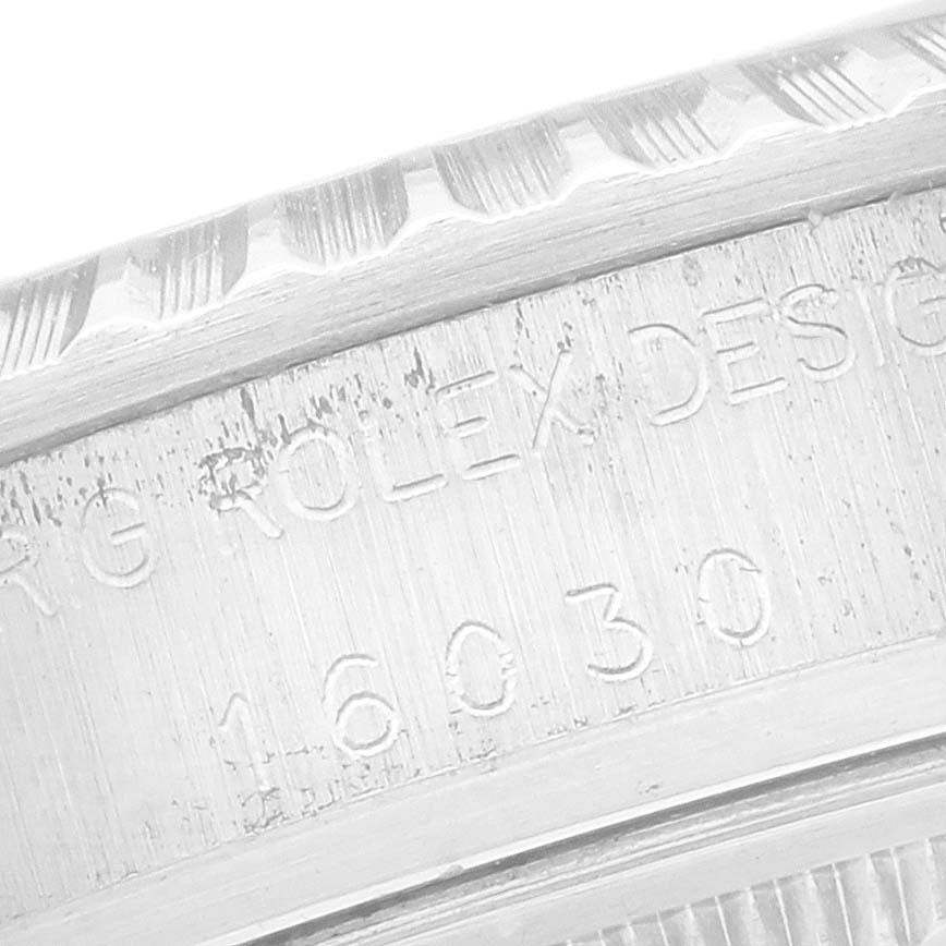 The close-up image shows the side engraving on the case of the Rolex Datejust 16030 Men's Stainless Steel Silver Dial 16030 Men's Stainless Steel Silver Dial watch, highlighting the serial and model numbers.