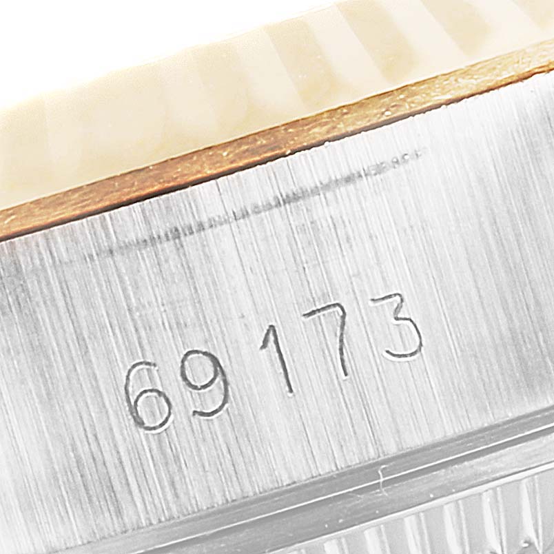 This close-up image shows the serial number "69173" engraved on the stainless steel case of a Rolex Datejust 69173 Women's Steel and Gold (two tone) Champagne Dial 69173 Women's Steel and Gold (two tone) Champagne Dial watch.