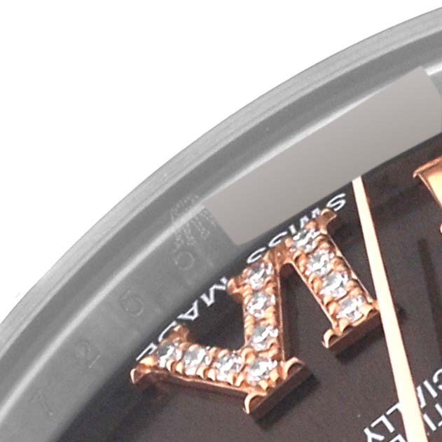 Close-up of a Rolex Mid-Size 178341 Women's Steel and Gold (two tone) Brown Dial 178341 Women's Steel and Gold (two tone) Brown Dial watch showing part of the bezel, dial, and diamond-studded Roman numerals.