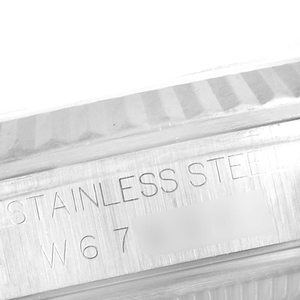This image shows a close-up of the stainless steel case and serial number of a Rolex Datejust 16234 Men's Stainless Steel Silver Dial 16234 Men's Stainless Steel Silver Dial watch.