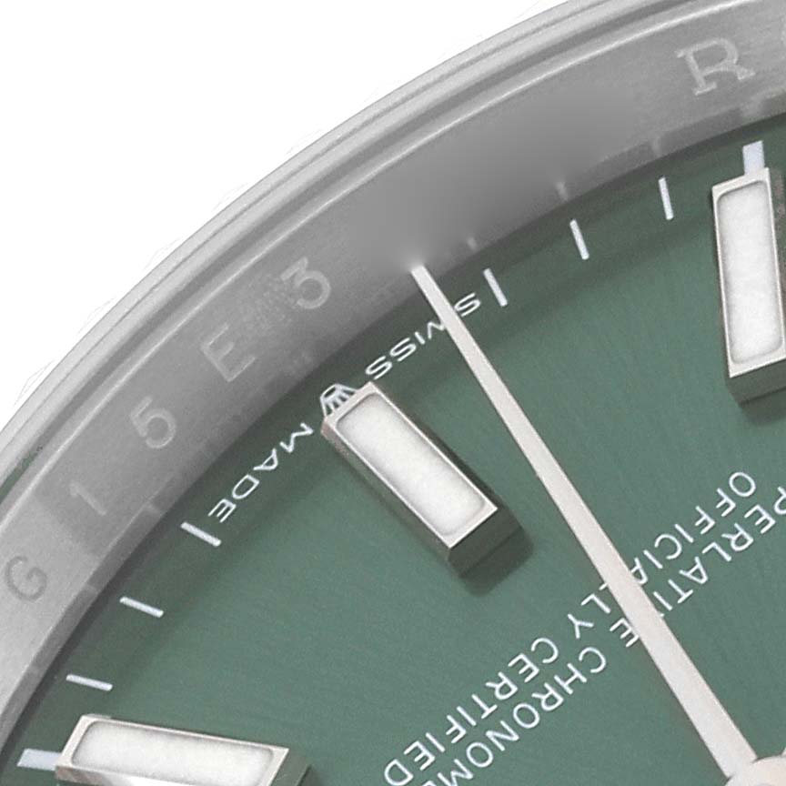 The image shows a close-up of the dial and part of the bezel of a Rolex Datejust 126234 Men's Stainless Steel Green Dial 126234 Men's Stainless Steel Green Dial watch.