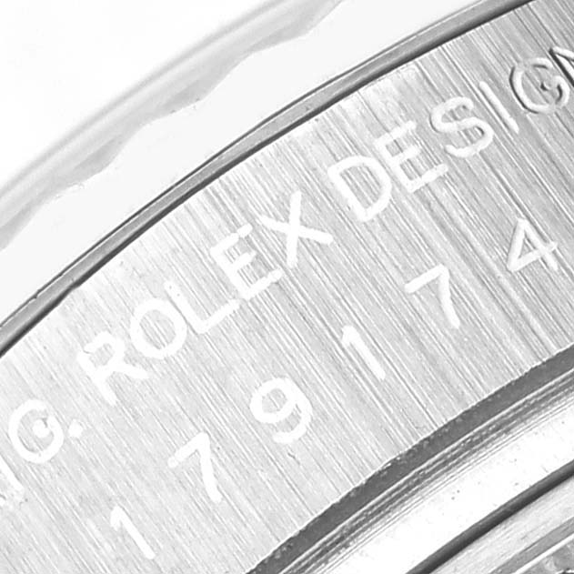 This image shows a close-up of the engraved bezel on a Rolex Datejust 179174 Women's Stainless Steel Mother of Pearl Dial 179174 Women's Stainless Steel Mother of Pearl Dial watch.