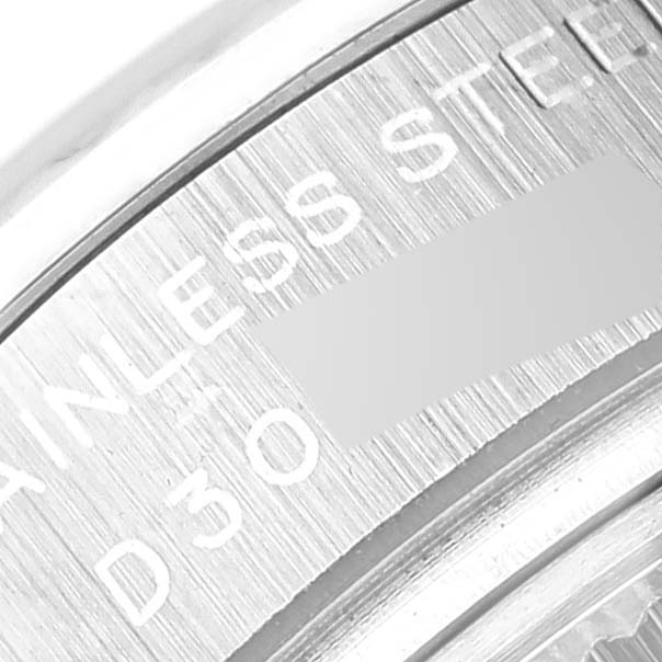 This close-up image shows part of the engraving on the stainless steel case of a Rolex Datejust 179174 Women's Stainless Steel Mother of Pearl Dial 179174 Women's Stainless Steel Mother of Pearl Dial watch.