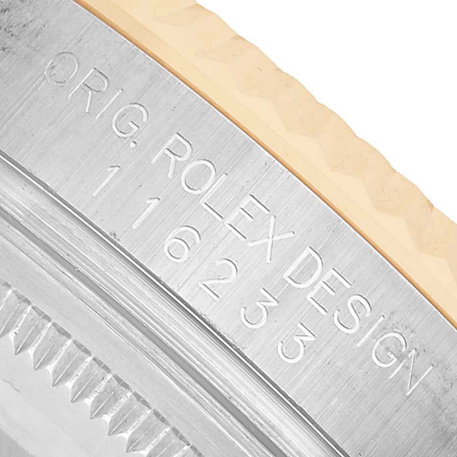 The image shows a close-up of the case side engraving on a Rolex Datejust 116233 Men's Steel and Gold (two tone) Silver Dial, displaying the model number.