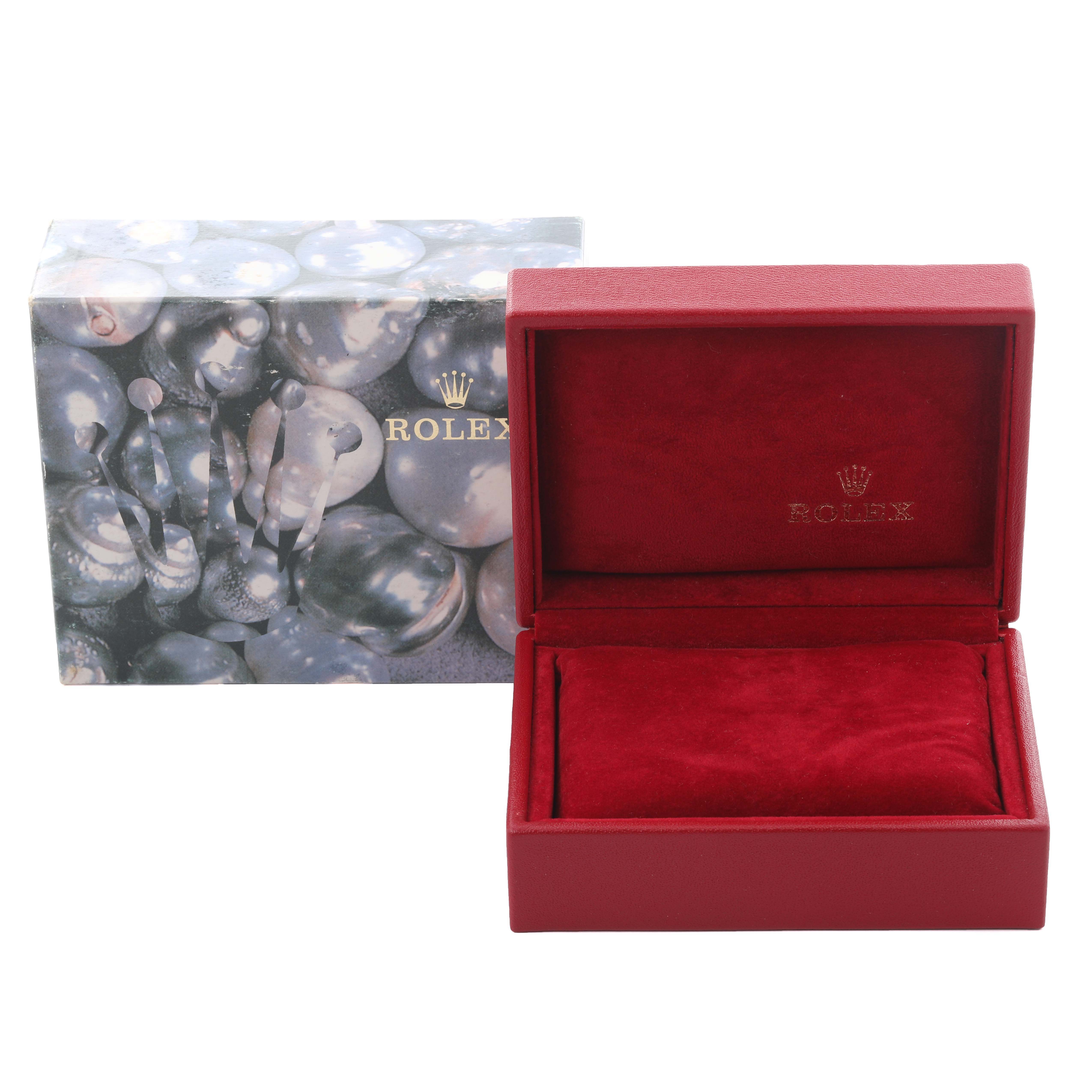 The image shows a Rolex Datejust 79173 Women's Steel and Gold (two tone) Blue Dial 79173 Women's Steel and Gold (two tone) Blue Dial watch box and cover at a straight angle, highlighting the interior and exterior designs.