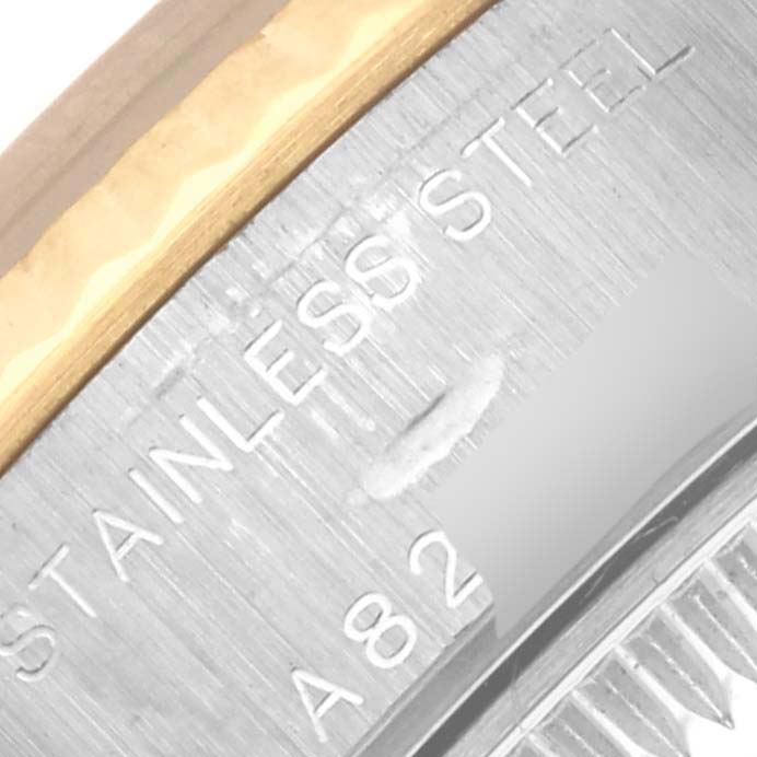 The image shows a close-up of the Rolex Datejust 79173 Women's Steel and Gold (two tone) Blue Dial 79173 Women's Steel and Gold (two tone) Blue Dial watch's case back with "STAINLESS STEEL" engraved.