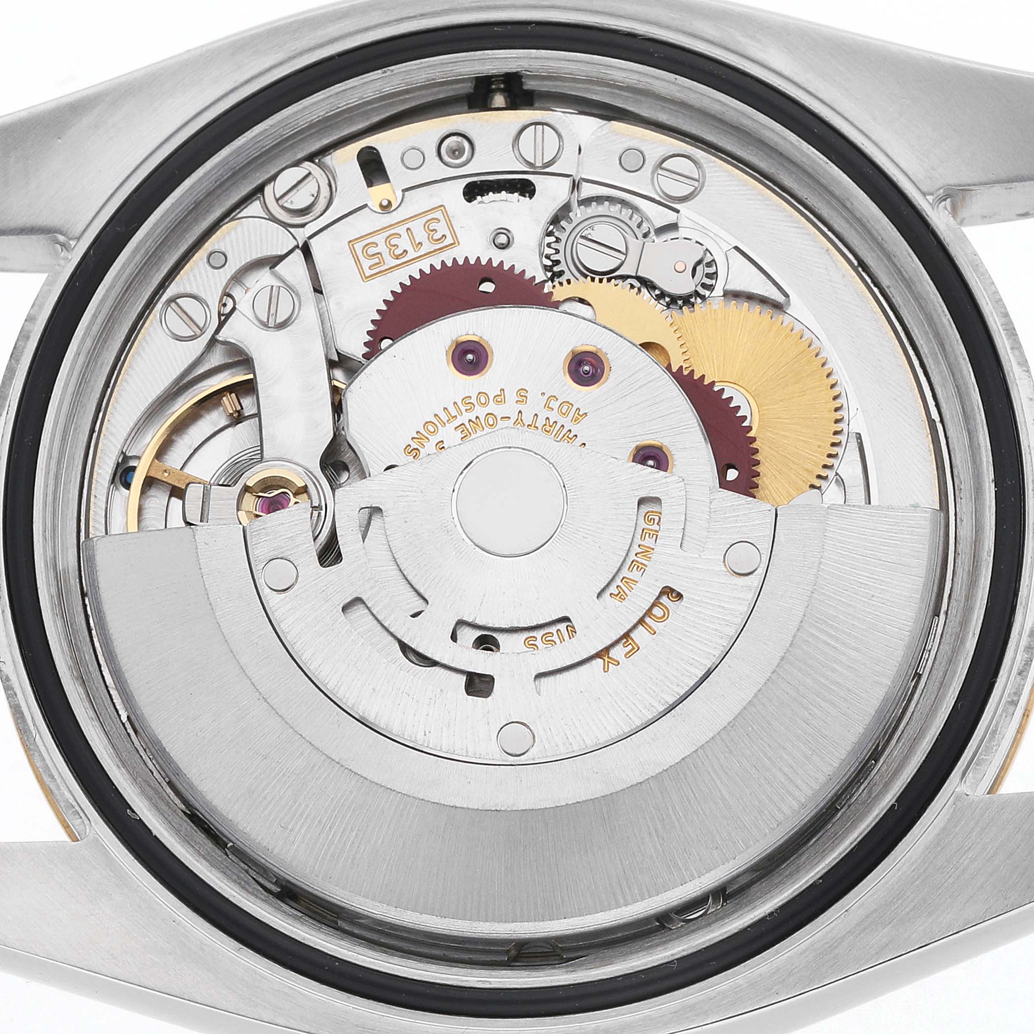 The image shows the movement of a Rolex Datejust 116233 Men's Steel and Gold (two tone) Champagne Dial watch from the back, highlighting gears and mechanical components.