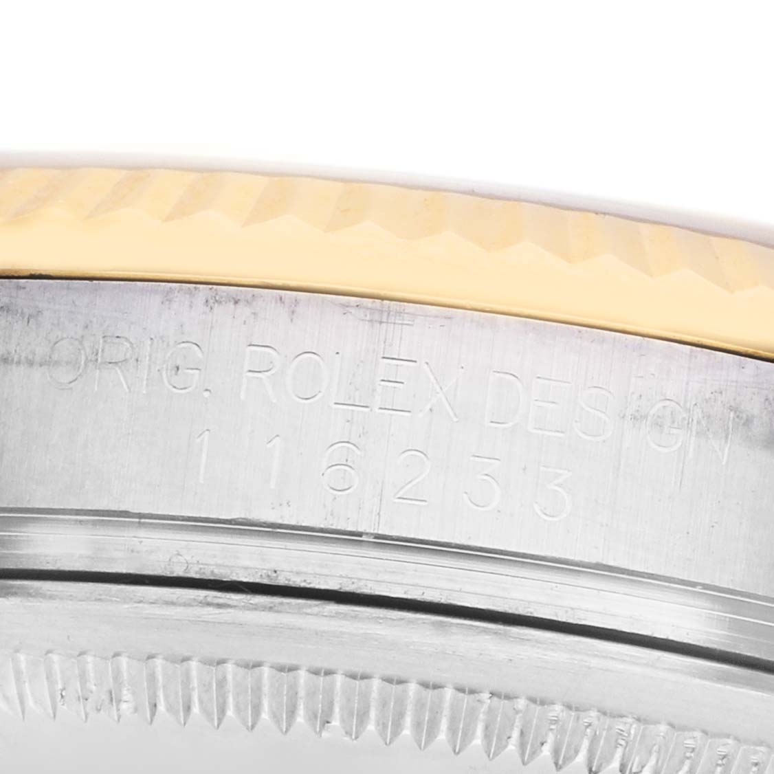 The image shows the side of a Rolex Datejust 116233 Men's Steel and Gold (two tone) Champagne Dial, focusing on the engraved case side with the model number.