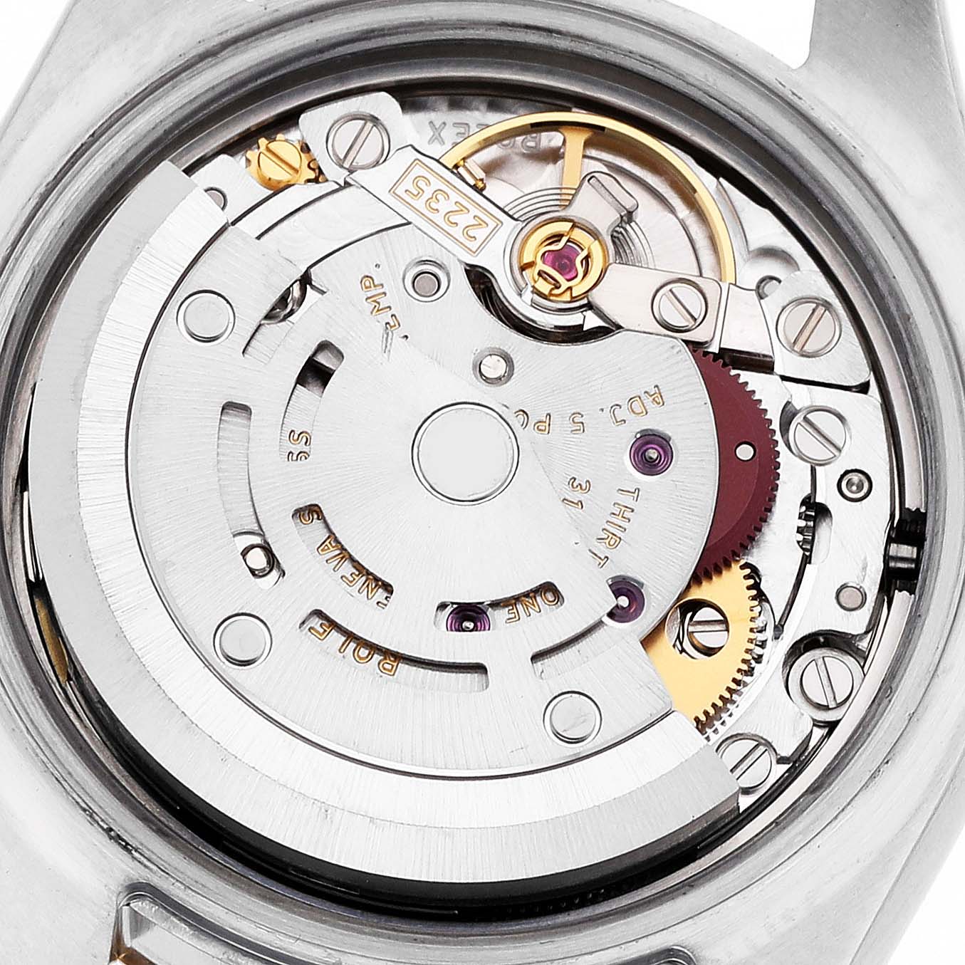 The image shows a close-up of the movement inside a Rolex Datejust 179173 Women's Steel and Gold (two tone) Champagne Dial, highlighting gears and the rotor.