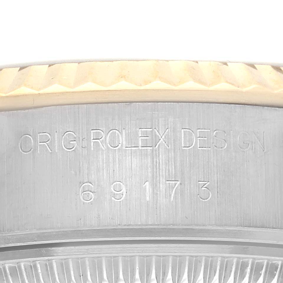 The image shows a close-up of the Rolex Datejust 69173 Women's Steel and Gold (two tone) Champagne Dial 69173 Women's Steel and Gold (two tone) Champagne Dial watch case side, featuring the model number and "ROLEX DESIGN" engraving.