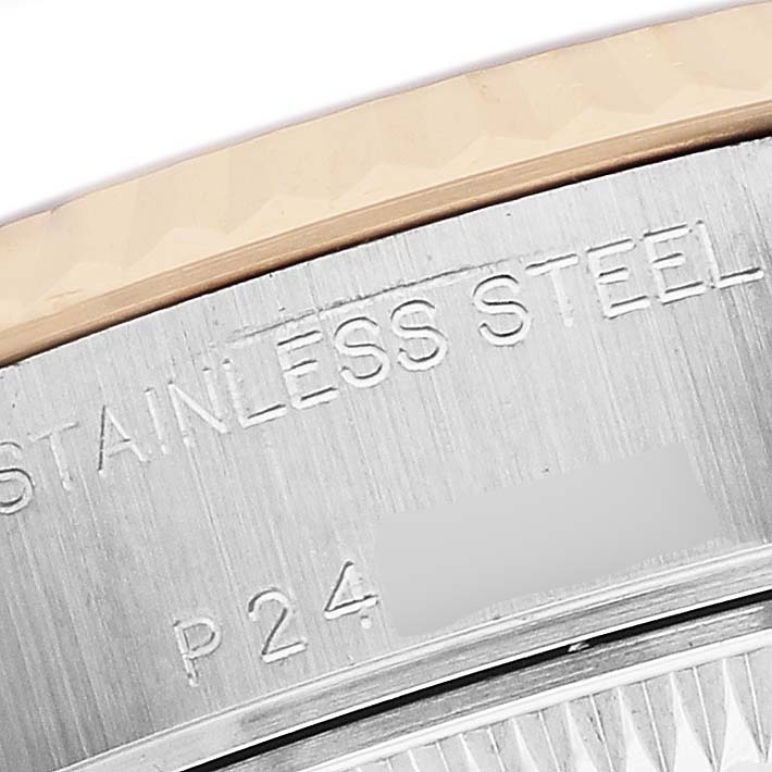 The image shows a close-up of the back case of a Rolex Datejust 79173 Women's Steel and Gold (two tone) Mother of Pearl Dial, highlighting the stainless steel part with engravings.