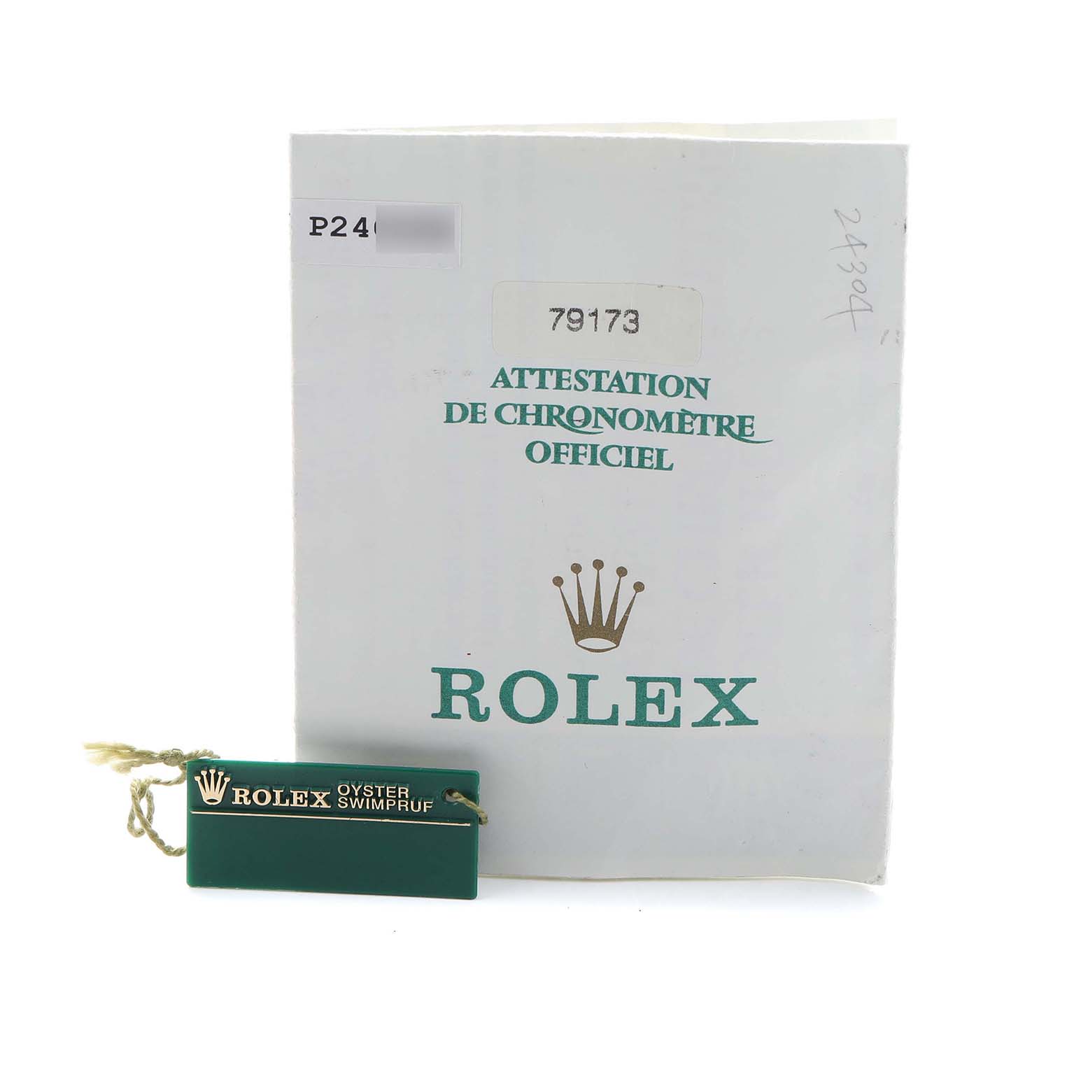 The image shows a Rolex Datejust 79173 Women's Steel and Gold (two tone) Mother of Pearl Dial warranty booklet and a green Rolex tag, both seen from the front.