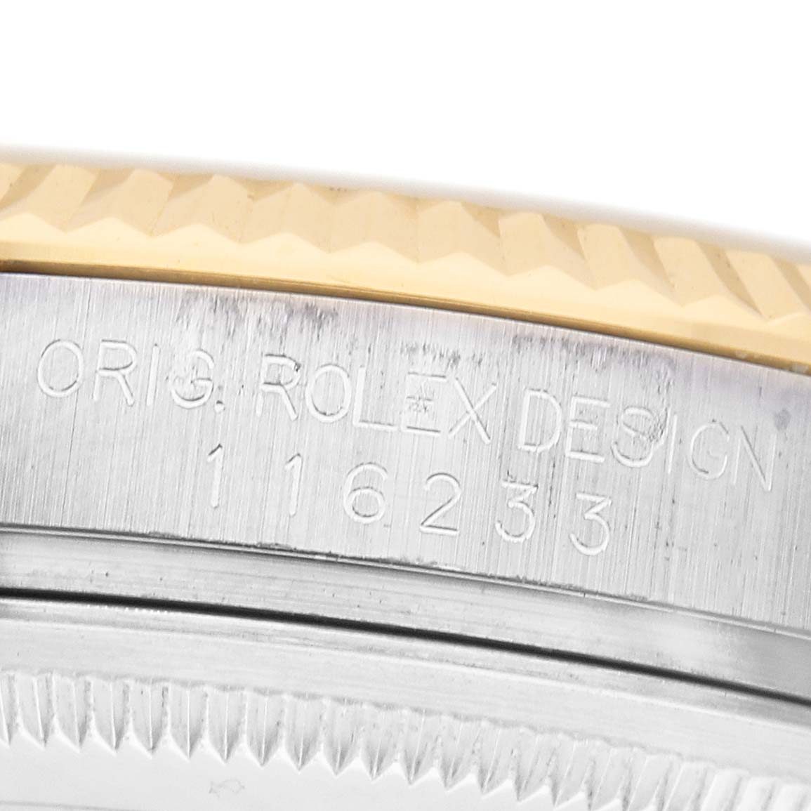 The image shows a close-up of the side of a Rolex Datejust 116233 Men's Stainless Steel Silver Dial, highlighting the model engraving and the fluted bezel.