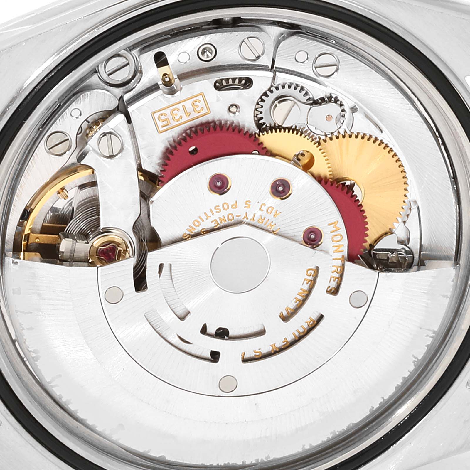 The image shows the internal mechanism of the Rolex Datejust 16233 Men
s Steel and Gold (two tone) Grey Dial 16233 Men
s Steel and Gold (two tone) Grey Dial watch, highlighting gears and components at a close-up angle.