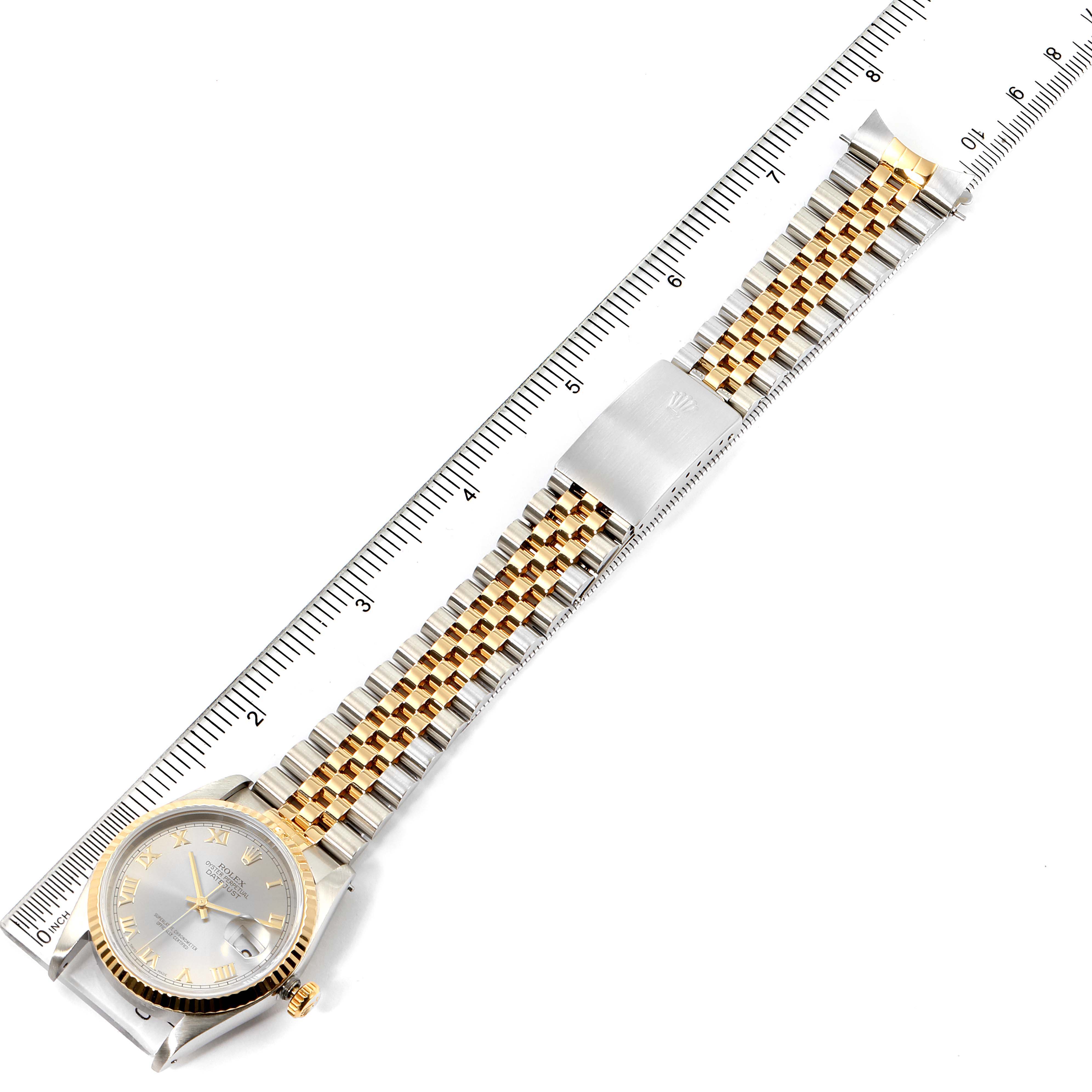 The image shows a Rolex Datejust 16233 Men
s Steel and Gold (two tone) Grey Dial 16233 Men
s Steel and Gold (two tone) Grey Dial watch, lying flat with its face, Jubilee bracelet, and clasp visible, aligned next to a ruler.