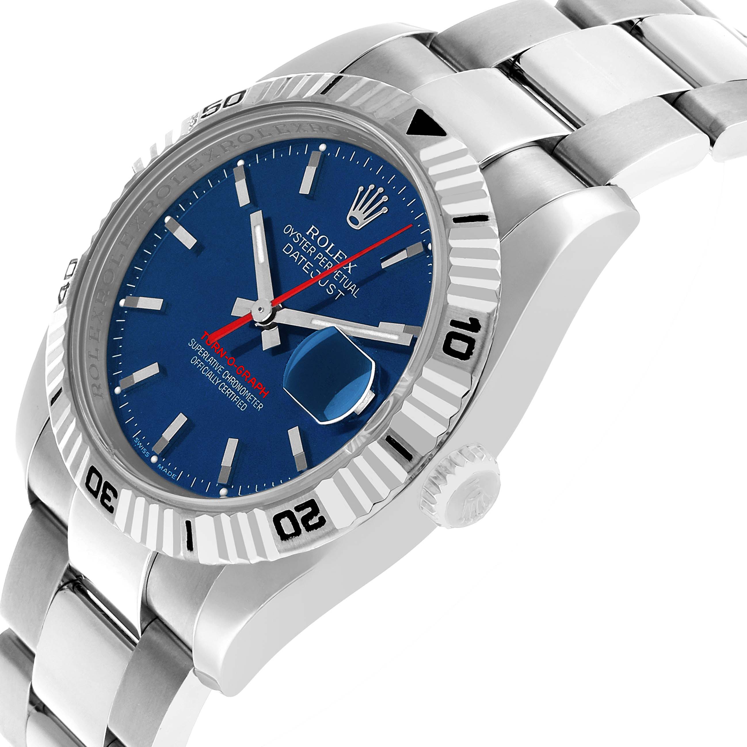 The Rolex Turn-o-Graph 116264 Men's Stainless Steel Blue Dial watch is shown at an angle highlighting its blue dial, fluted bezel, and metal bracelet.