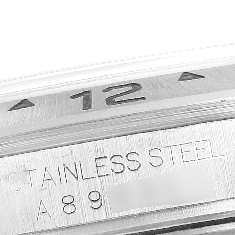 The close-up image shows the bezel and part of the stainless steel casing of a Rolex Explorer 16570 Men
s Stainless Steel Black Dial 16570 Men
s Stainless Steel Black Dial watch.