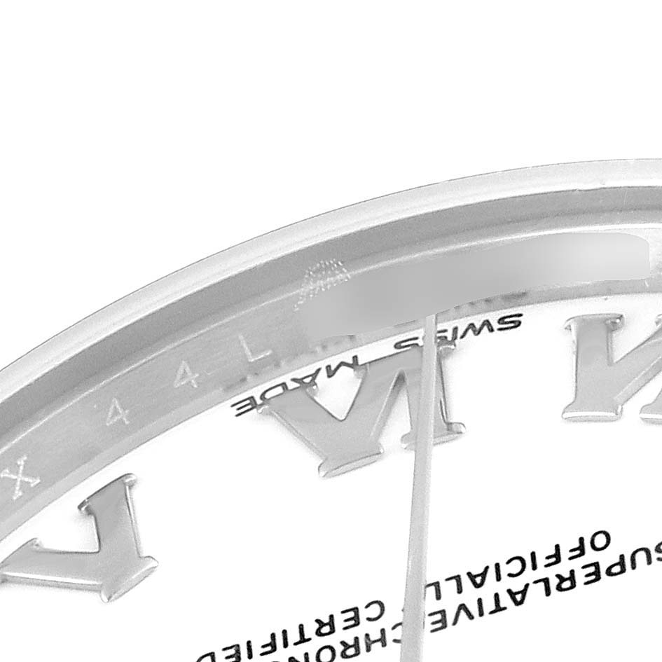 The image shows a close-up of a Rolex Mid-Size 178240 Women
s Stainless Steel White Dial 178240 Women
s Stainless Steel White Dial watch dial, featuring Roman numerals and part of the second hand.