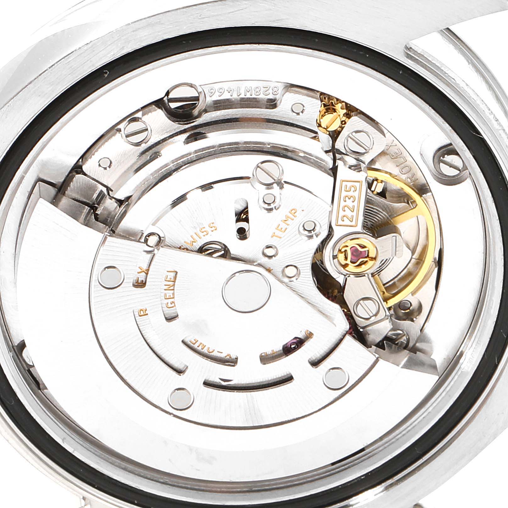 This image shows the internal mechanical movement of a Mid-Size Rolex watch from a top-down angle, highlighting the rotor and balance wheel.