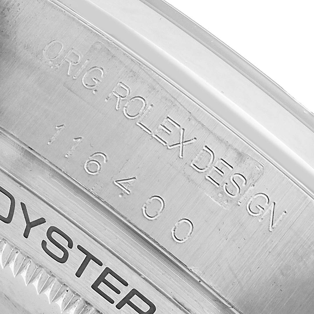 The image shows the engraved side of a Rolex Milgauss 116400 Men's Stainless Steel Black Dial model, displaying the design and model number.