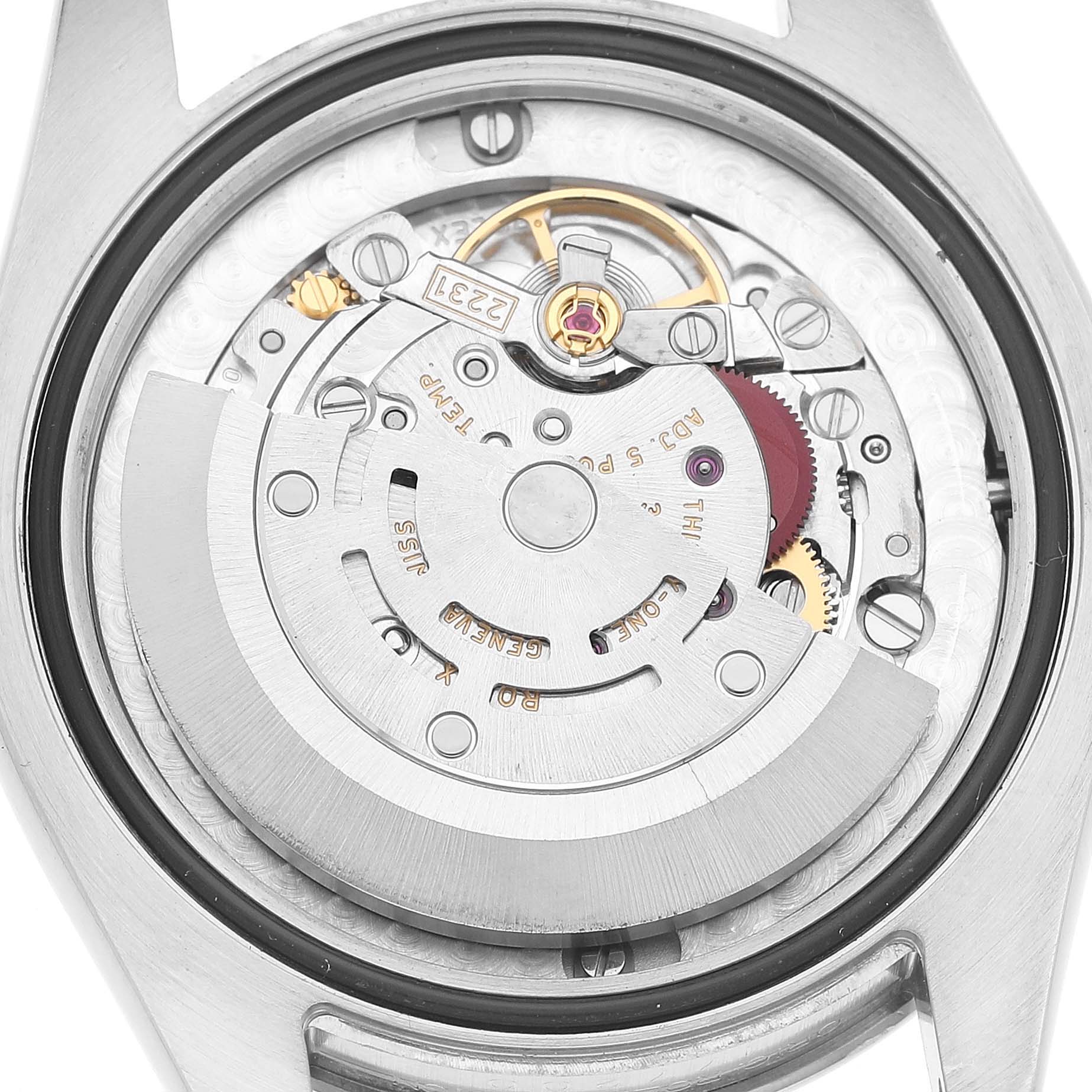The image shows the movement of a Rolex Oyster Perpetual 177200 Women's Stainless Steel Pink Dial watch from a top-down angle, highlighting the rotor and mechanical components.