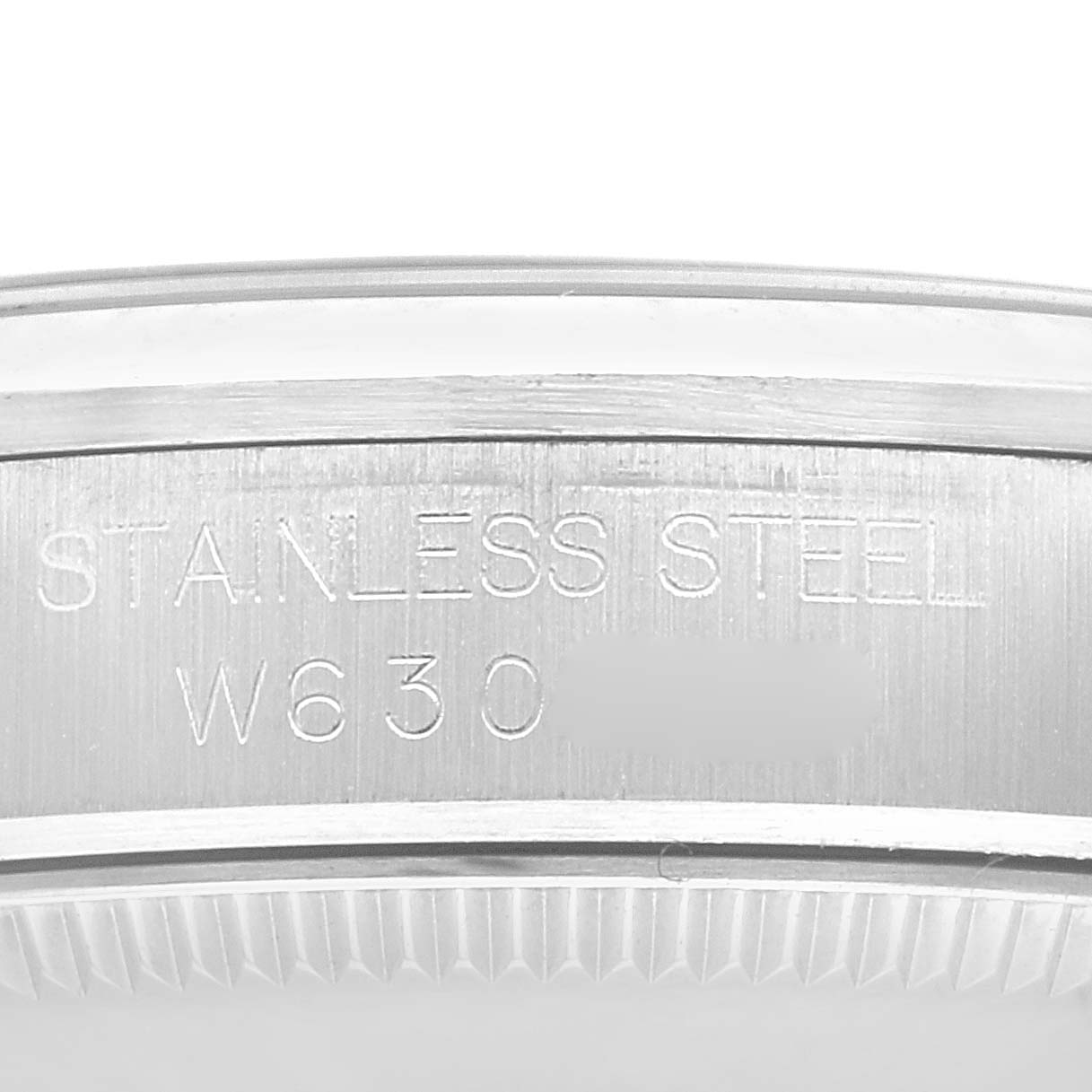 The image shows a detailed close-up of the case back edge, revealing "STAINLESS STEEL" and partial serial number, typical of a Rolex Mid-Size 67480 Women's Stainless Steel Black Dial 67480 Women's Stainless Steel Black Dial.