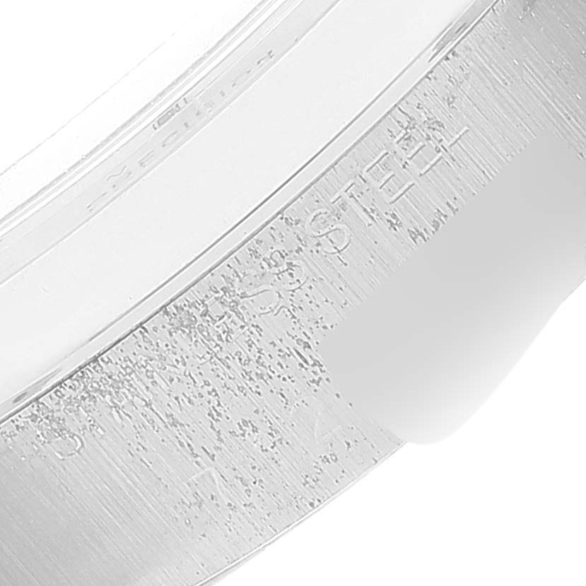 This image shows a close-up of the side of the bezel and engraved details on the case of a Rolex Date 6694 Men's Stainless Steel Silver Dial 6694 Men's Stainless Steel Silver Dial model watch.