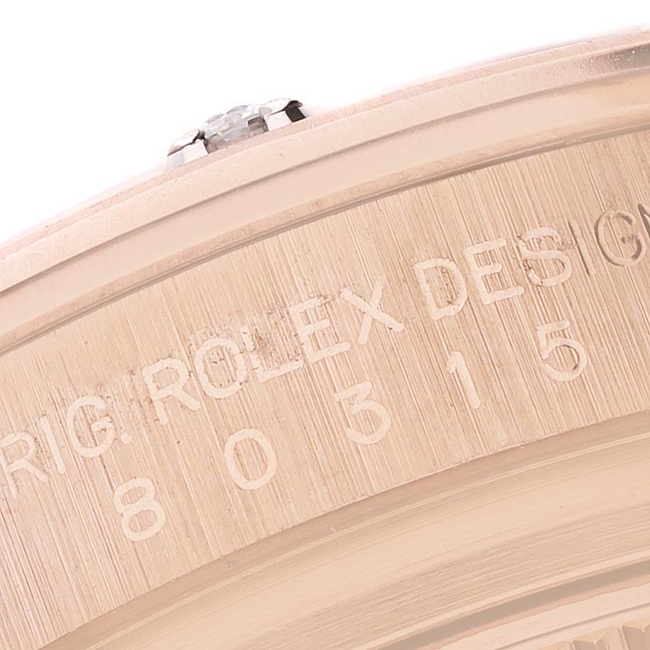This close-up image shows the engraved side detail of the Rolex Pearlmaster 80315 Women's Rose Gold Mother of Pearl Dial 80315 Women's Rose Gold Mother of Pearl Dial watch case.