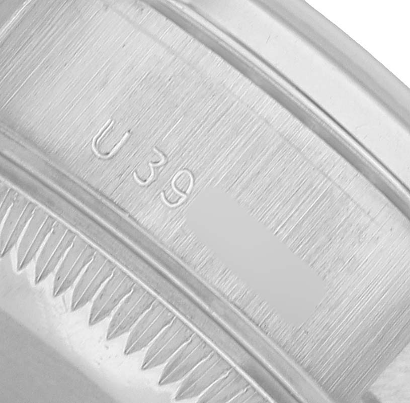 The image shows a close-up of the edge of the bezel and inner rim with markings on a Rolex President 69136 Women's Platinum Silver Dial watch.