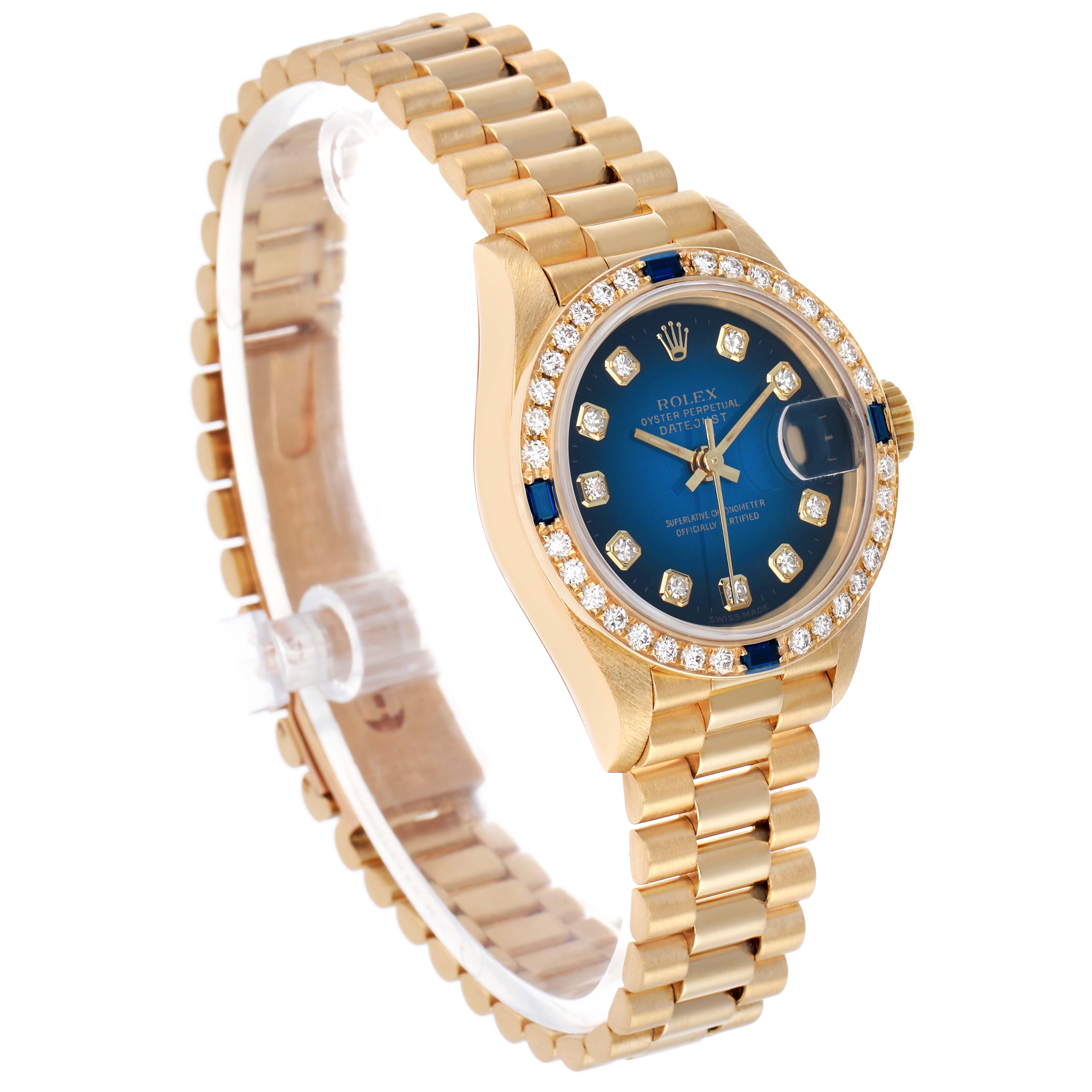 The Rolex President 69088 Women's Yellow Gold Blue Dial model watch is shown at an angled side view, highlighting its blue dial, diamond bezel, and gold bracelet.