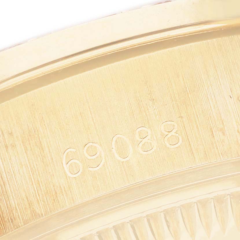 The image shows the gold clasp with engraved numbers on a Rolex President 69088 Women's Yellow Gold Blue Dial watch.