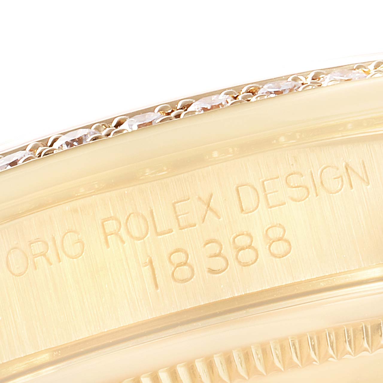 This close-up image shows the case edge of the Rolex President 18388 Men's Yellow Gold Brown Dial 18388 Men's Yellow Gold Brown Dial model, highlighting the engraved design number.