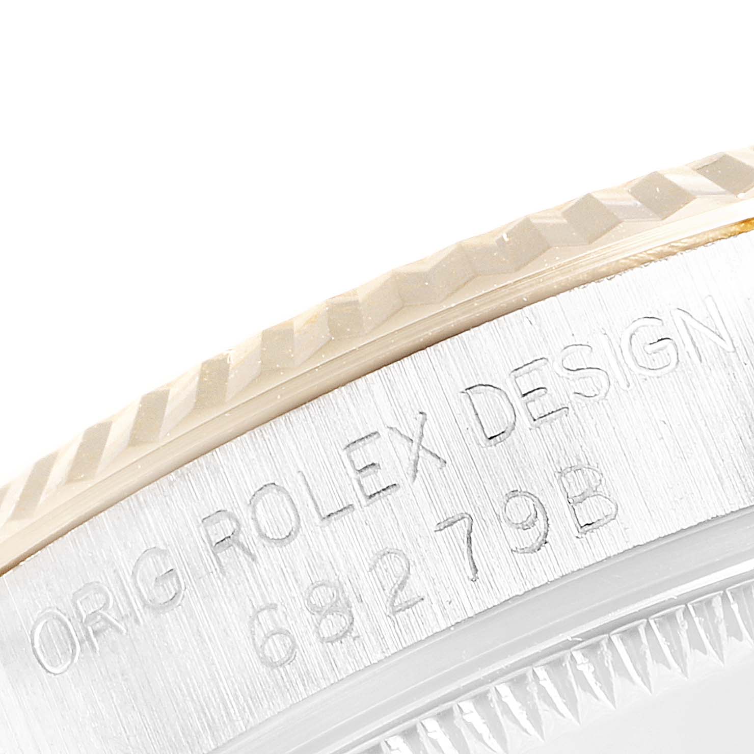 The image shows an angled close-up of the engraved side detailing on a Rolex President 68279 Women's Yellow Gold Brown Dial 68279 Women's Yellow Gold Brown Dial model watch.