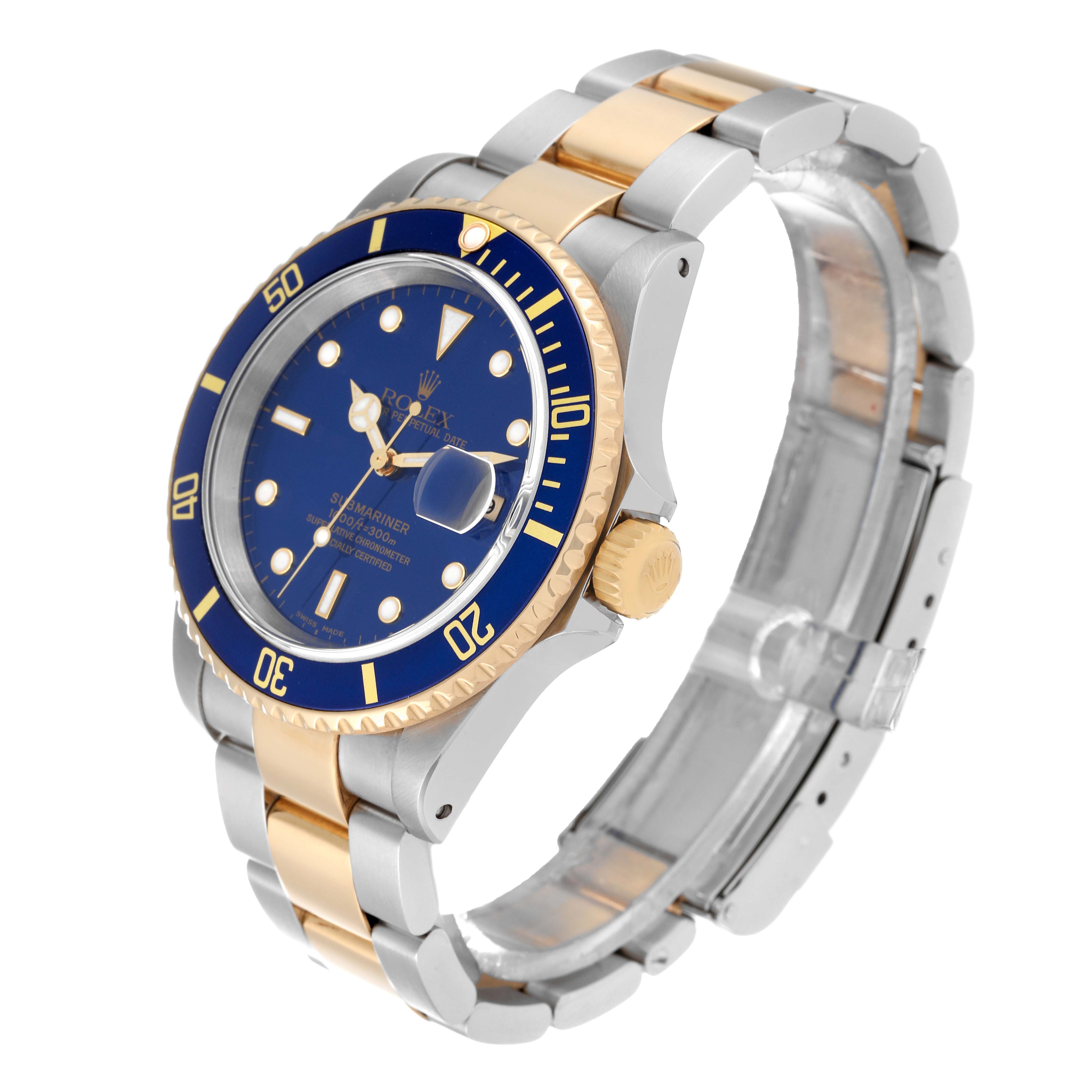 This Rolex Submariner 16613 Men
s Steel and Gold (two tone) Blue Dial 16613 Men
s Steel and Gold (two tone) Blue Dial watch is shown at a slight angle, displaying its blue dial, bezel, crown, and two-tone bracelet.