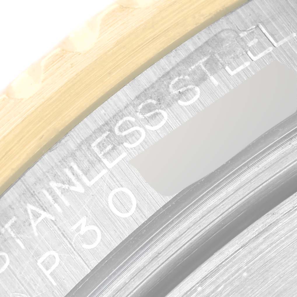 The image shows a close-up of the stainless steel casing and part of the bezel of a Rolex Submariner 16613 Men
s Steel and Gold (two tone) Blue Dial 16613 Men
s Steel and Gold (two tone) Blue Dial watch.