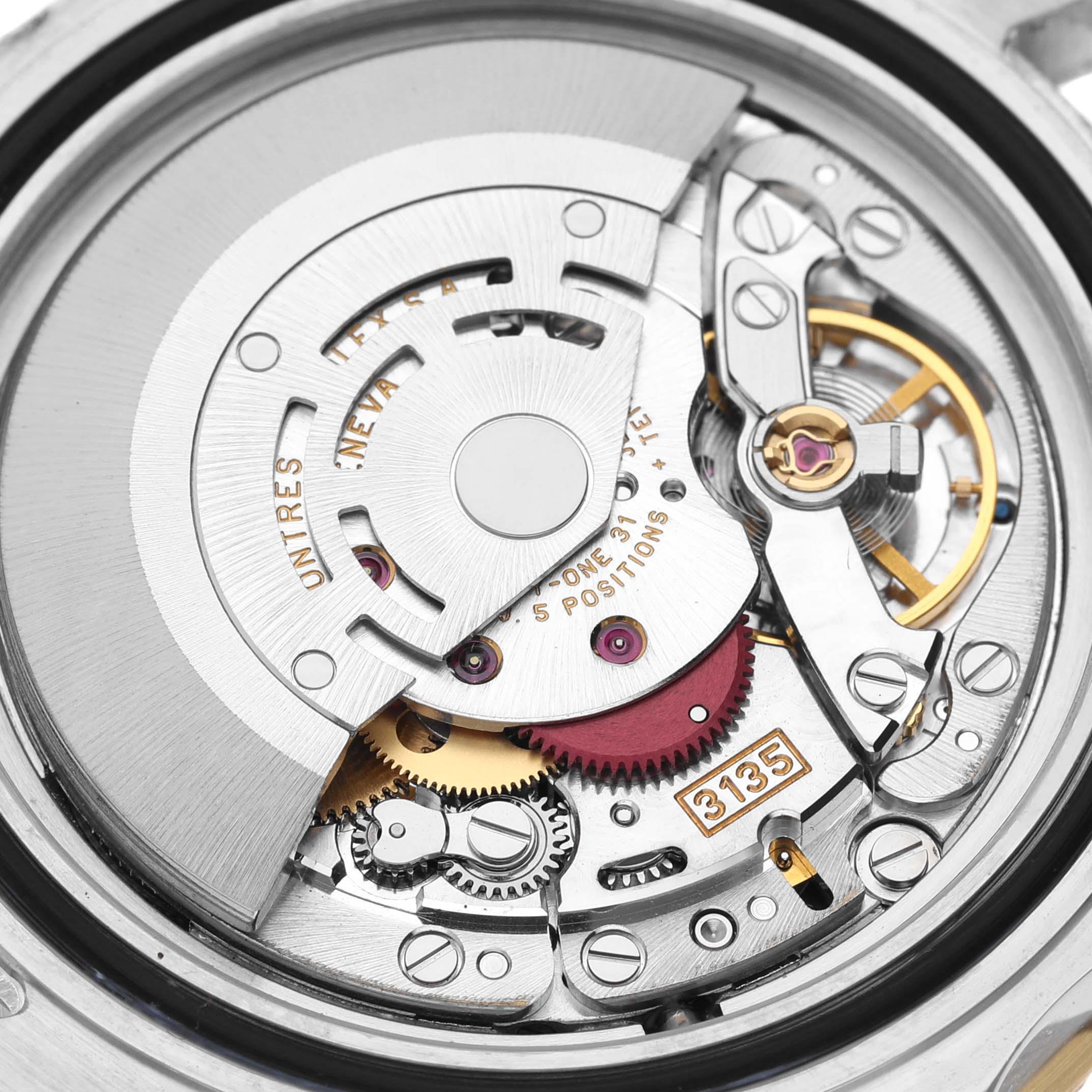This image shows a close-up of the movement mechanism of a Rolex Submariner 16613 Men
s Steel and Gold (two tone) Blue Dial 16613 Men
s Steel and Gold (two tone) Blue Dial watch model, highlighting gears and the rotor.