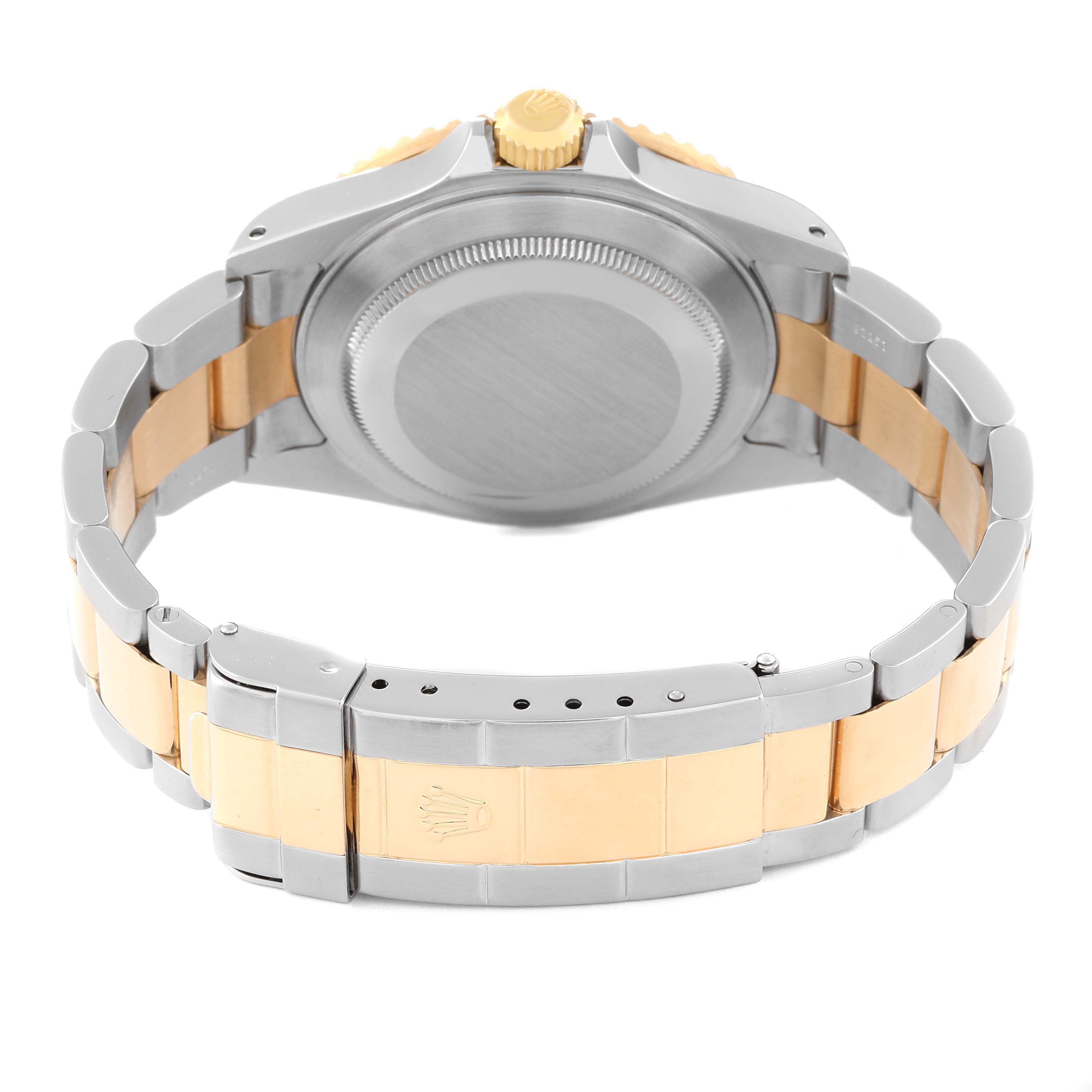 The image shows the back case and bracelet clasp of a Rolex Submariner 16613 Men
s Steel and Gold (two tone) Blue Dial 16613 Men
s Steel and Gold (two tone) Blue Dial watch in a two-tone design.