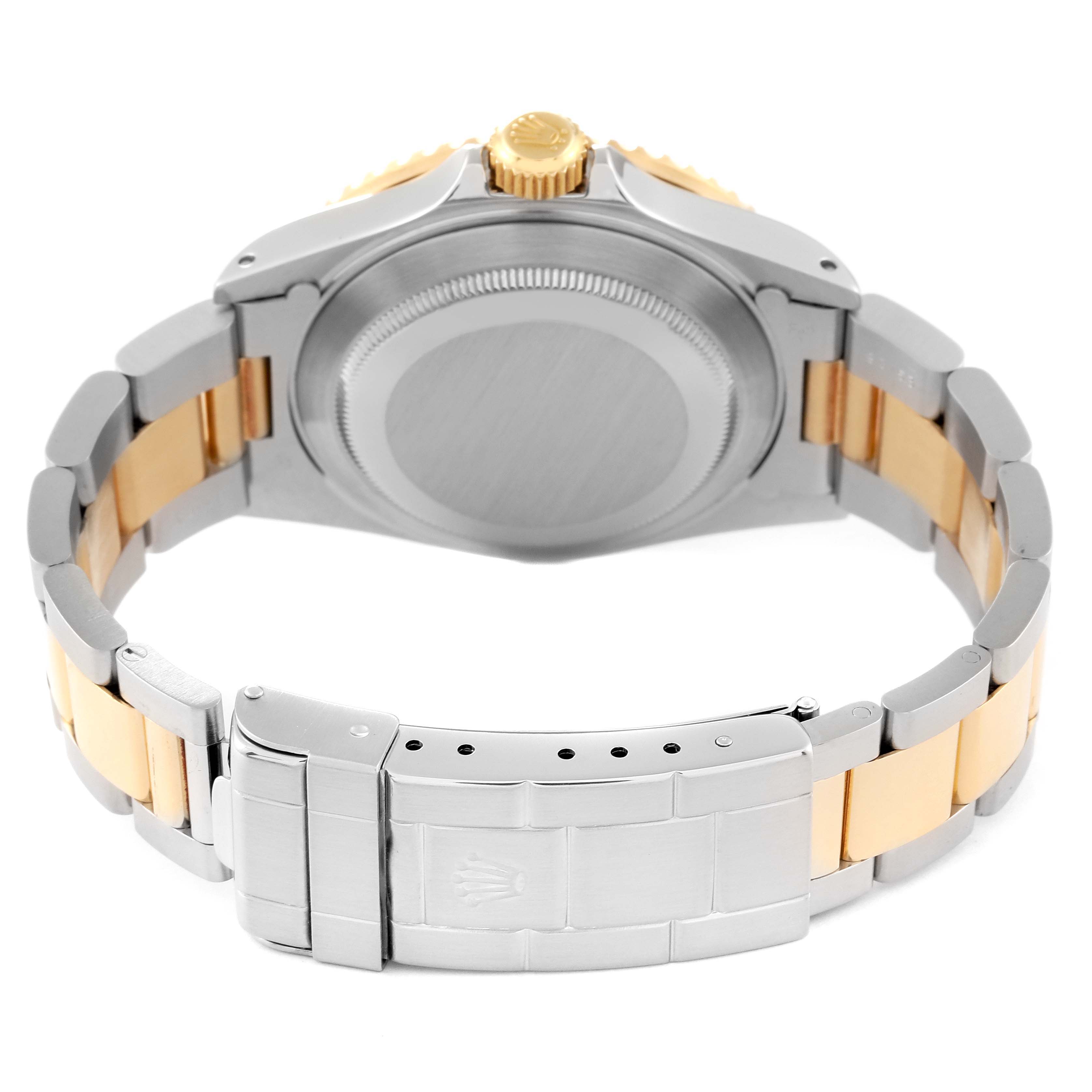 The image shows the back view of a Rolex Submariner 16613 Men
s Steel and Gold (two tone) Blue Dial 16613 Men
s Steel and Gold (two tone) Blue Dial watch, focusing on the case, crown, and bracelet clasp.