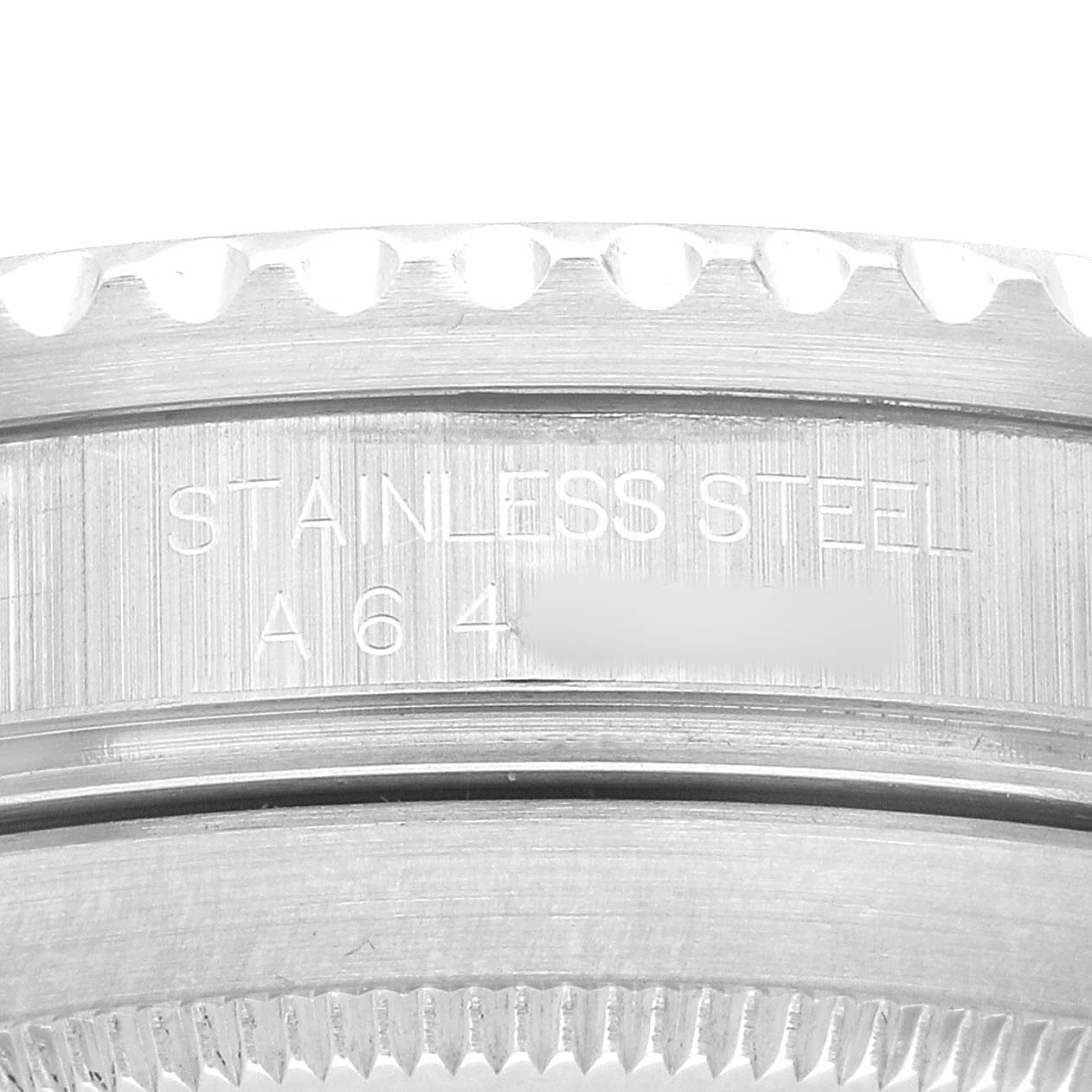 The image shows a close-up of the stainless steel case back edge of a Rolex Submariner 16610 Men's Stainless Steel Black Dial.