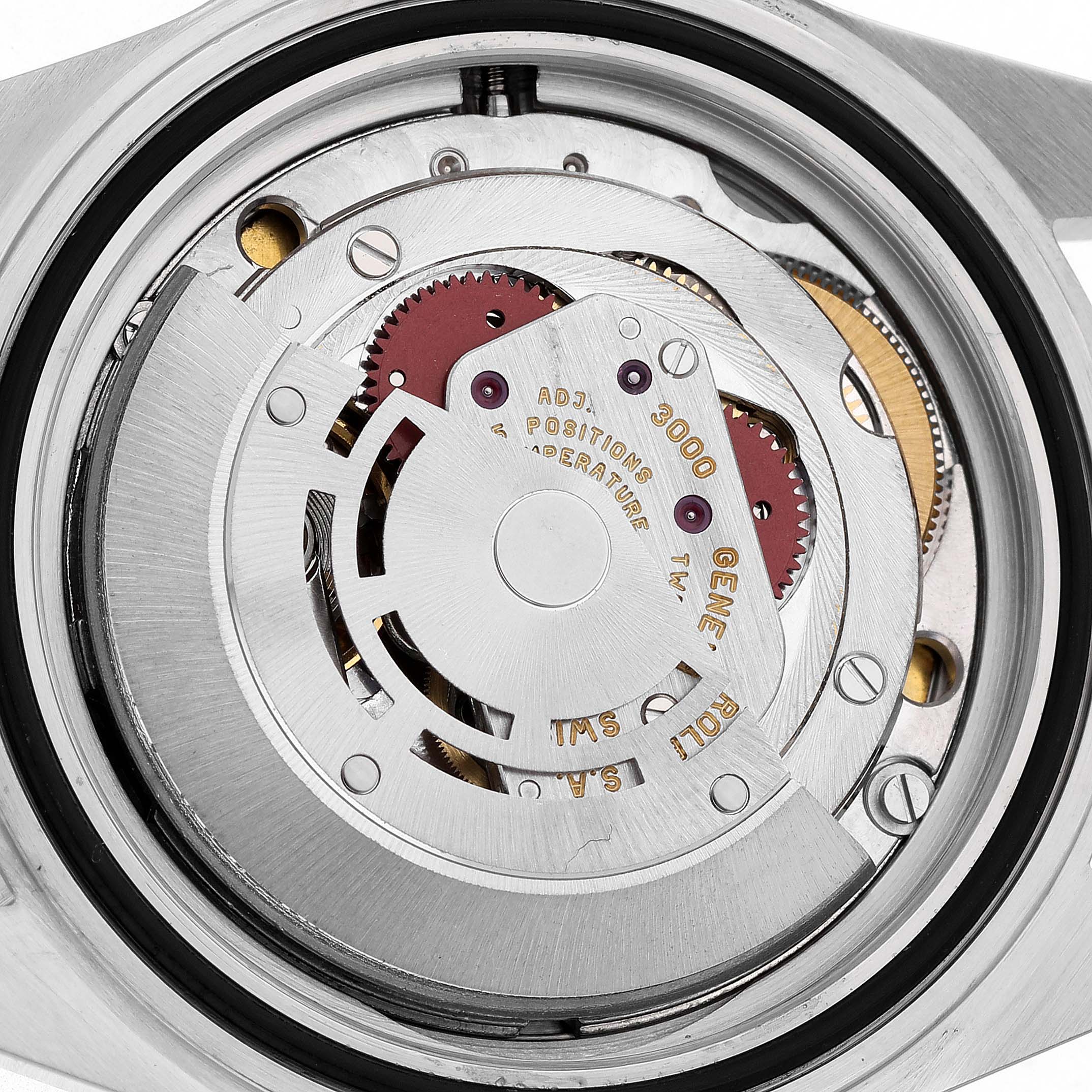 The image shows the case back of a Rolex Submariner 14060 Men's Stainless Steel Black Dial, revealing its movement and rotor from a top-down angle.