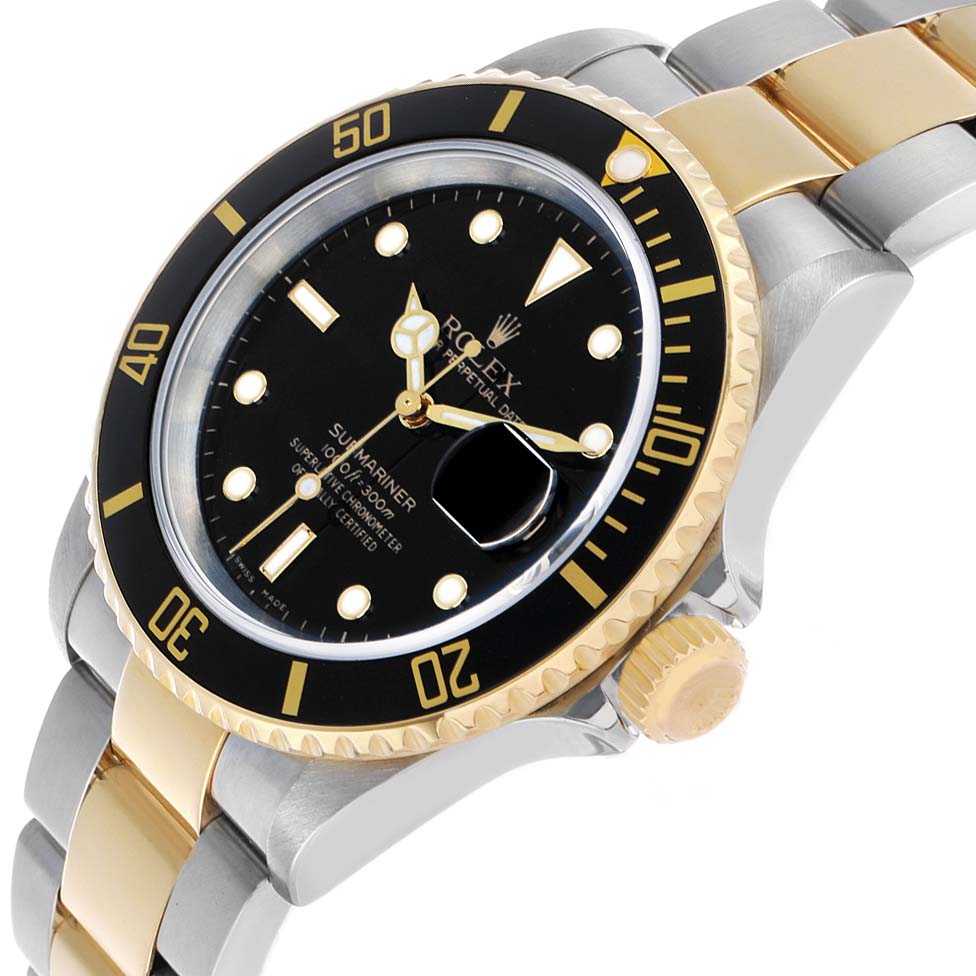 The Rolex Submariner 16613 Men's Steel and Gold (two tone) Black Dial watch is shown at an angled side view, highlighting the face, bezel, crown, and a portion of the bracelet.