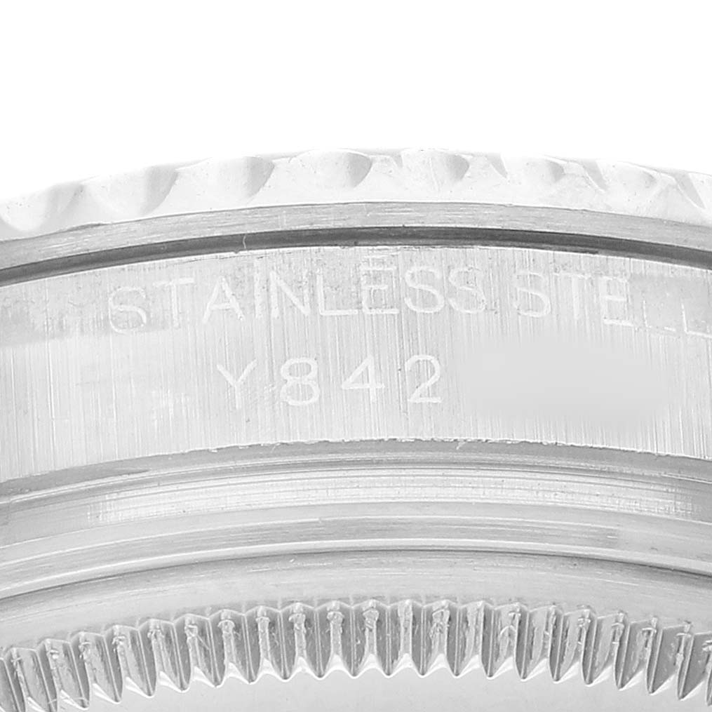 The image shows a close-up of the engraved side of a Rolex Yacht-Master 168622 Men's Stainless Steel Silver Dial, focusing on the bezel and part of the case back.