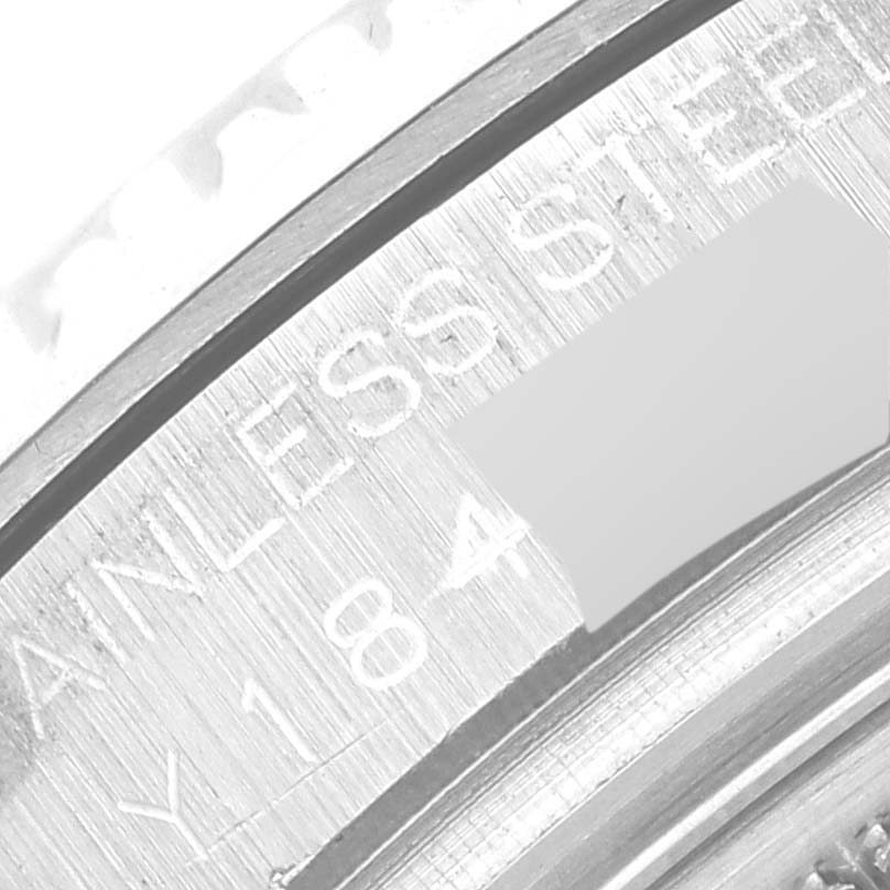 This close-up image shows the engraved details on the steel case of a Rolex Yacht-Master 168622 Men's Stainless Steel Silver Dial 168622 Men's Stainless Steel Silver Dial watch.